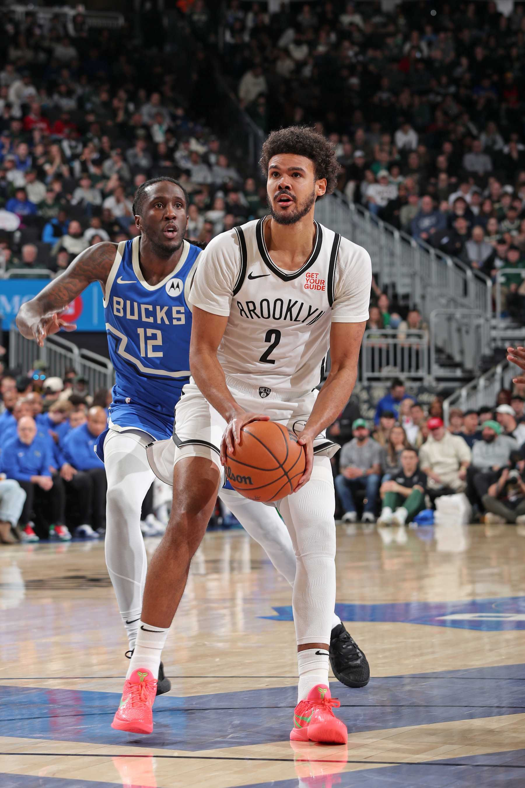 MILWAUKEE, WI - DECEMBER 26: Cameron Johnson #2 of the Brooklyn Nets handles the ball during the game against the Milwaukee Bucks on December 26, 2024 at Fiserv Forum Center in Milwaukee, Wisconsin. NOTE TO USER: User expressly acknowledges and agrees that, by downloading and or using this Photograph, user is consenting to the terms and conditions of the Getty Images License Agreement. Mandatory Copyright Notice: Copyright 2024 NBAE (Photo by Gary Dineen/NBAE via Getty Images).