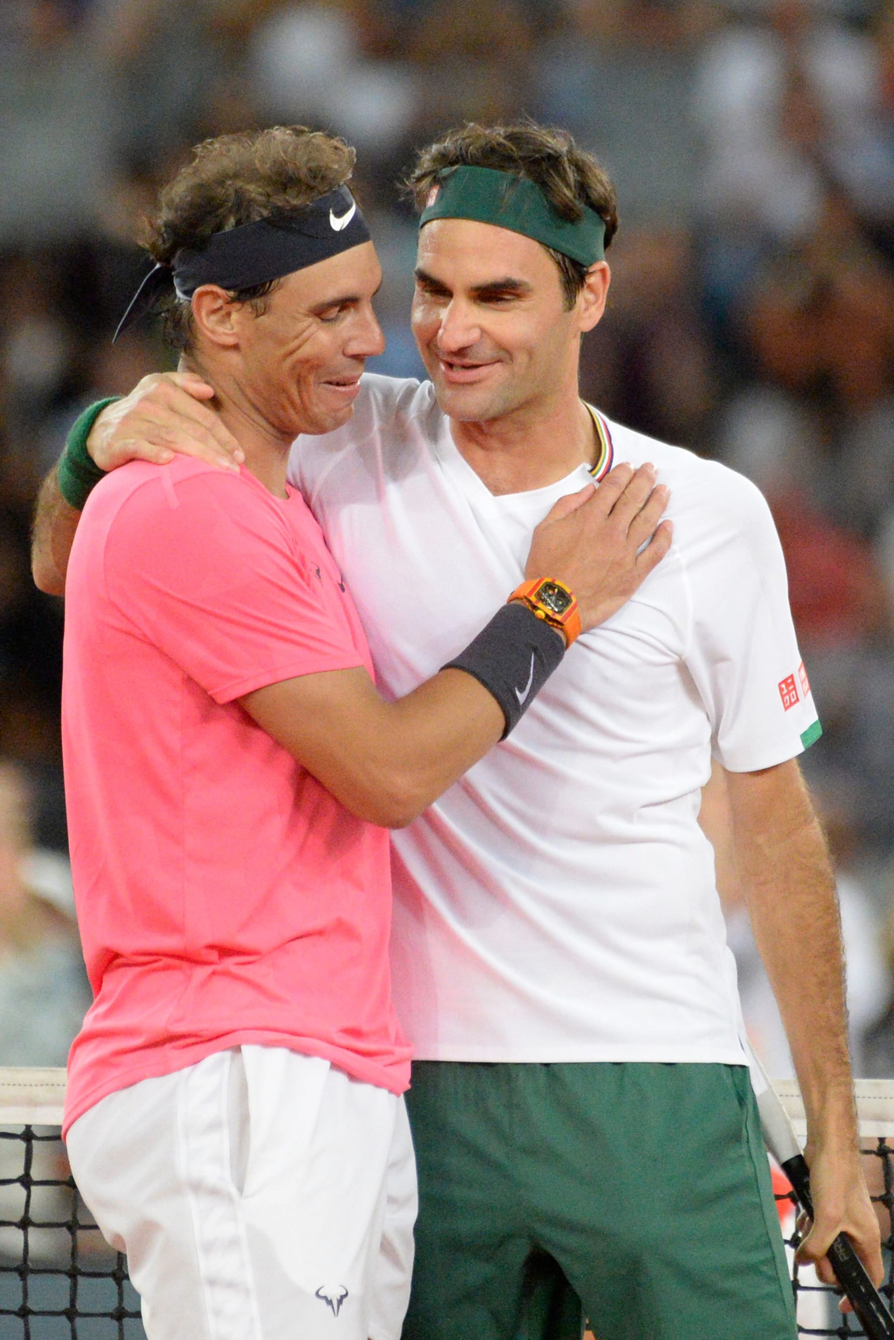 Switzerland's Roger Federer (R) hugs Spain's Rafael Nadal (L) during their tennis match at The Match in Africa at the Cape Town Stadium, in Cape Town on February 7, 2020. (Photo by RODGER BOSCH / AFP) (Photo by RODGER BOSCH/AFP via Getty Images)