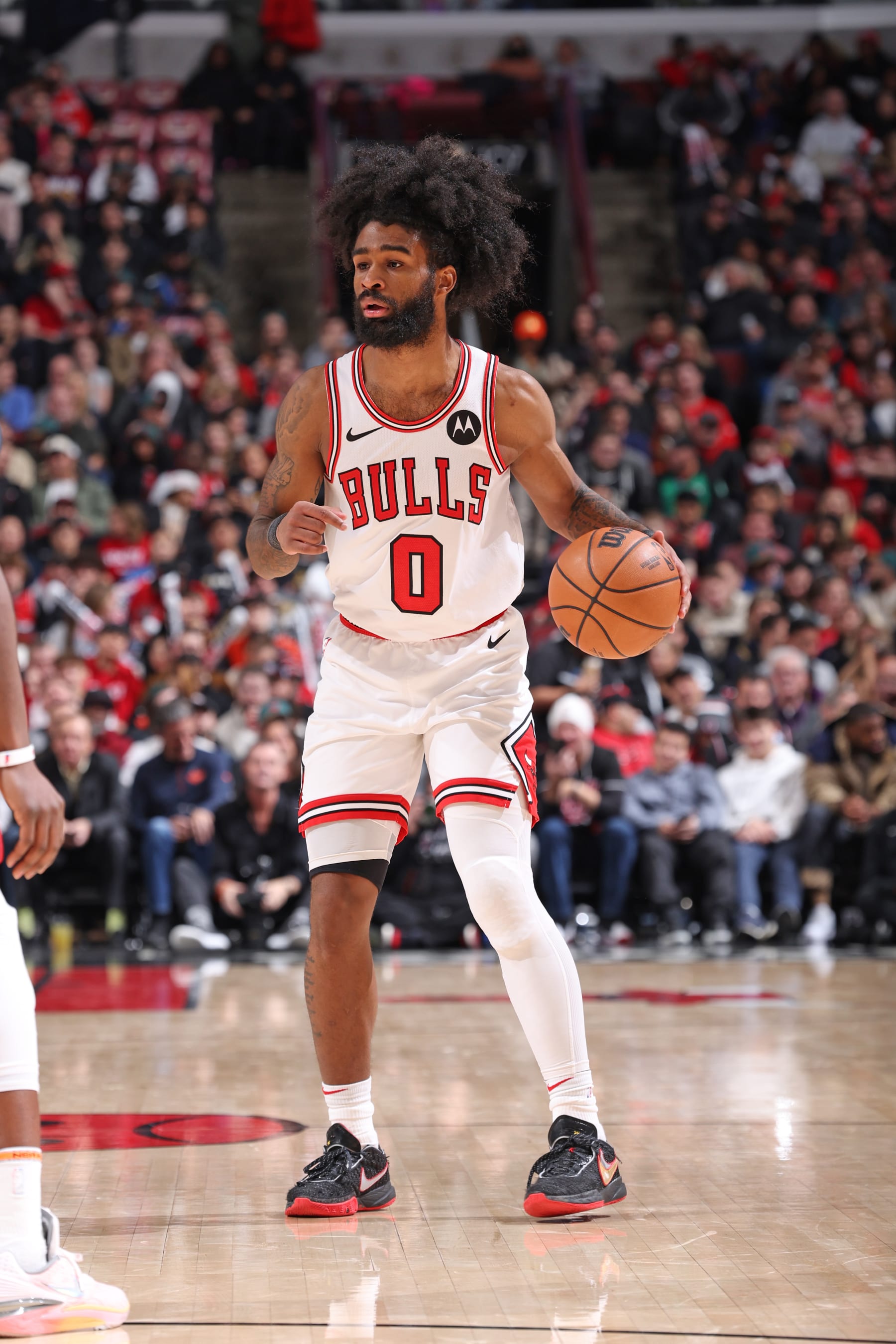 CHICAGO, IL - DECEMBER 12: Coby White #0 of the Chicago Bulls dribbles the ball during the game against the Denver Nuggets on December 12, 2023 at United Center in Chicago, Illinois. NOTE TO USER: User expressly acknowledges and agrees that, by downloading and or using this photograph, User is consenting to the terms and conditions of the Getty Images License Agreement. Mandatory Copyright Notice: Copyright 2023 NBAE (Photo by Jeff Haynes/NBAE via Getty Images)