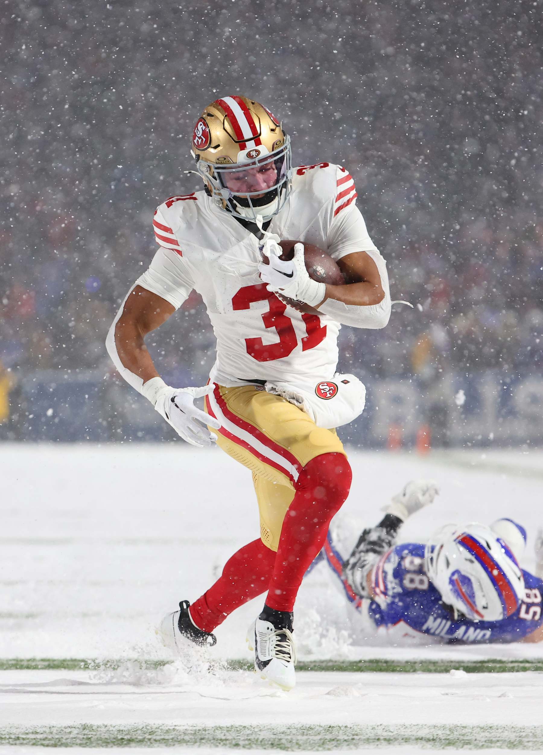ORCHARD PARK, NEW YORK - DECEMBER 1: Isaac Guerendo #31 of the San Francisco 49ers runs the ball against the Buffalo Bills at Highmark Stadium on December 1, 2024 in Orchard Park, New York. (Photo by Timothy T Ludwig/Getty Images)