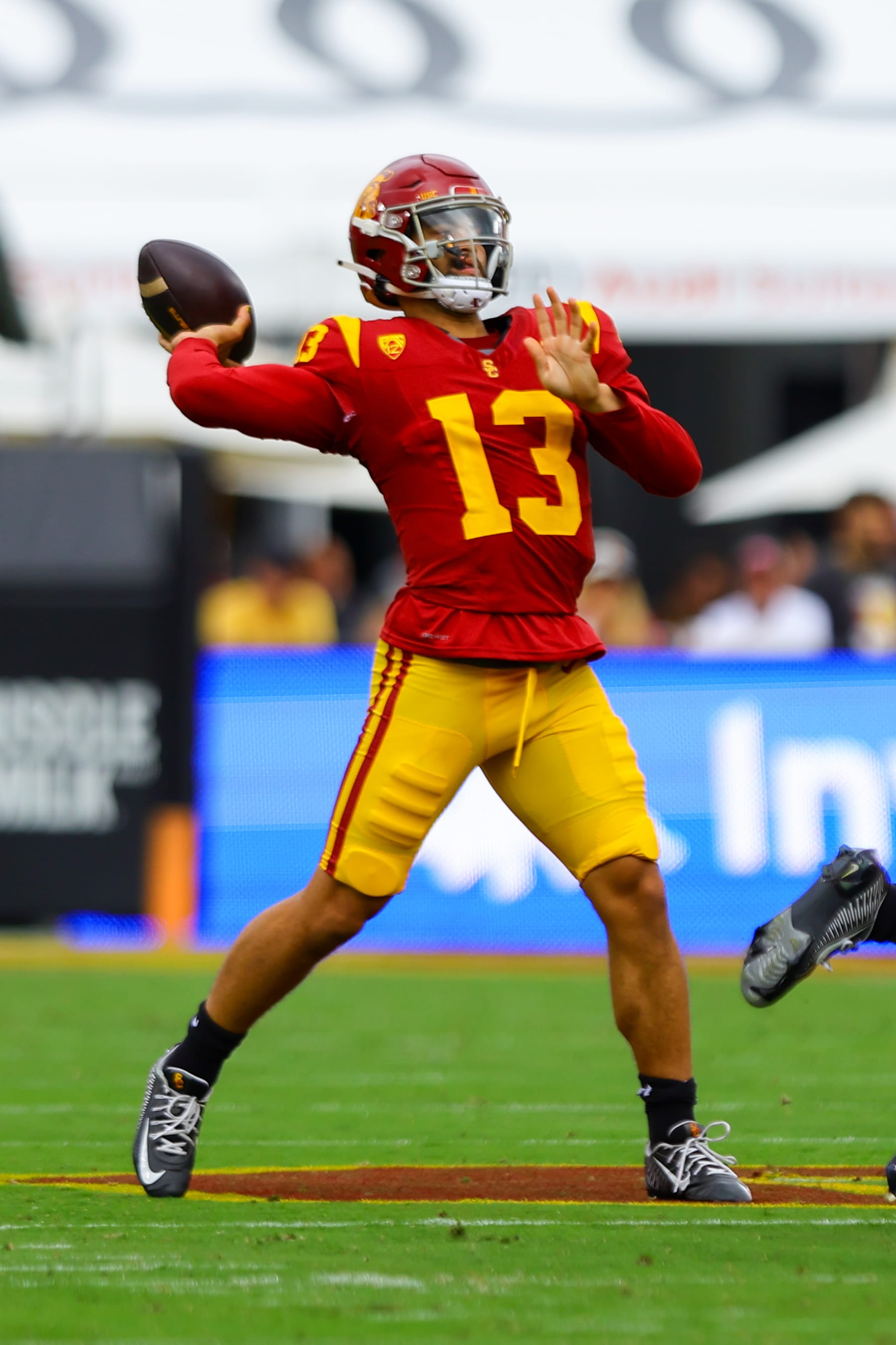 LOS ANGELES, CA - SEPTEMBER 02: USC Trojans quarterback Caleb Williams (13) drops back to throw the ball during a college football game between the Nevada Wolf Pack against the USC Trojans on September 02, 2023, at the Los Angeles Memorial Coliseum in Los Angeles, CA. (Photo by Jordon Kelly/Icon Sportswire via Getty Images)