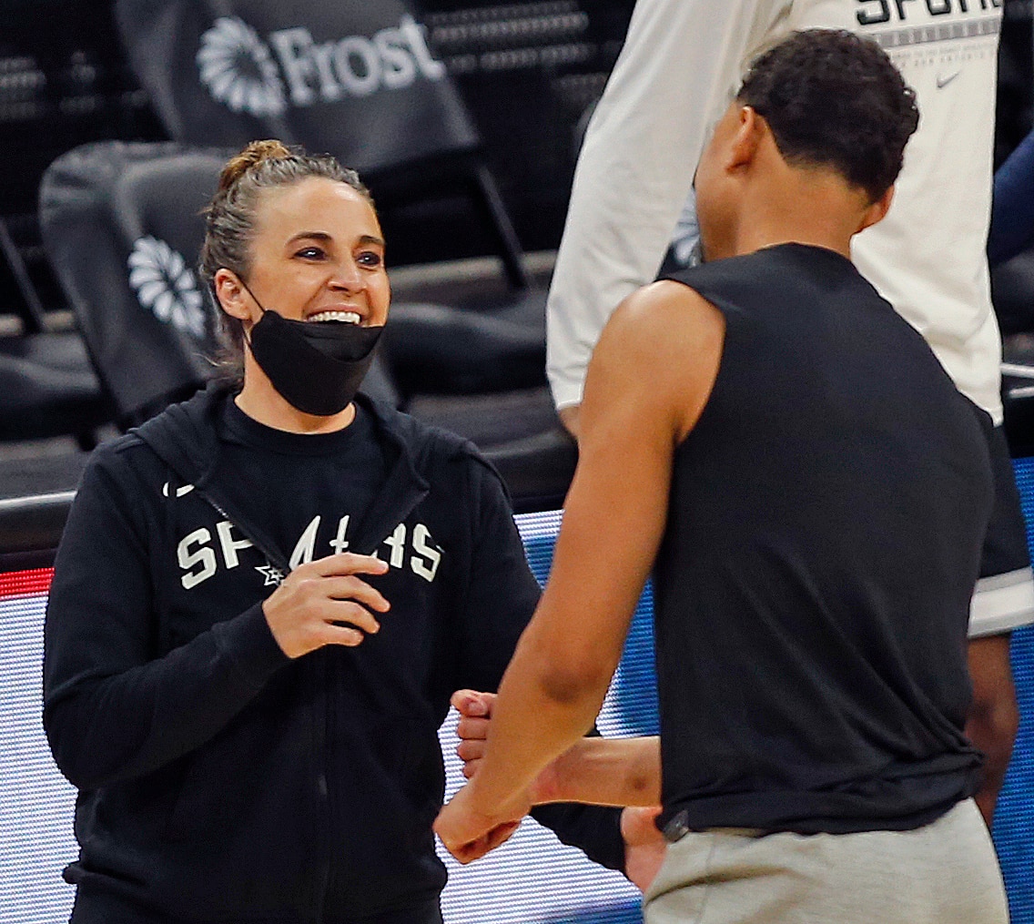 SAN ANTONIO, TX - MAY 10:  Becky Hammon assistant coach for the San Antonio Spurs greets Bryn Forbes #7 of the Milwaukee Bucks  at AT&T Center on May 10, 2021 in San Antonio, Texas.  NOTE TO USER: User expressly acknowledges and agrees that , by downloading and or using this photograph, User is consenting to the terms and conditions of the Getty Images License Agreement. (Photo by Ronald Cortes/Getty Images)