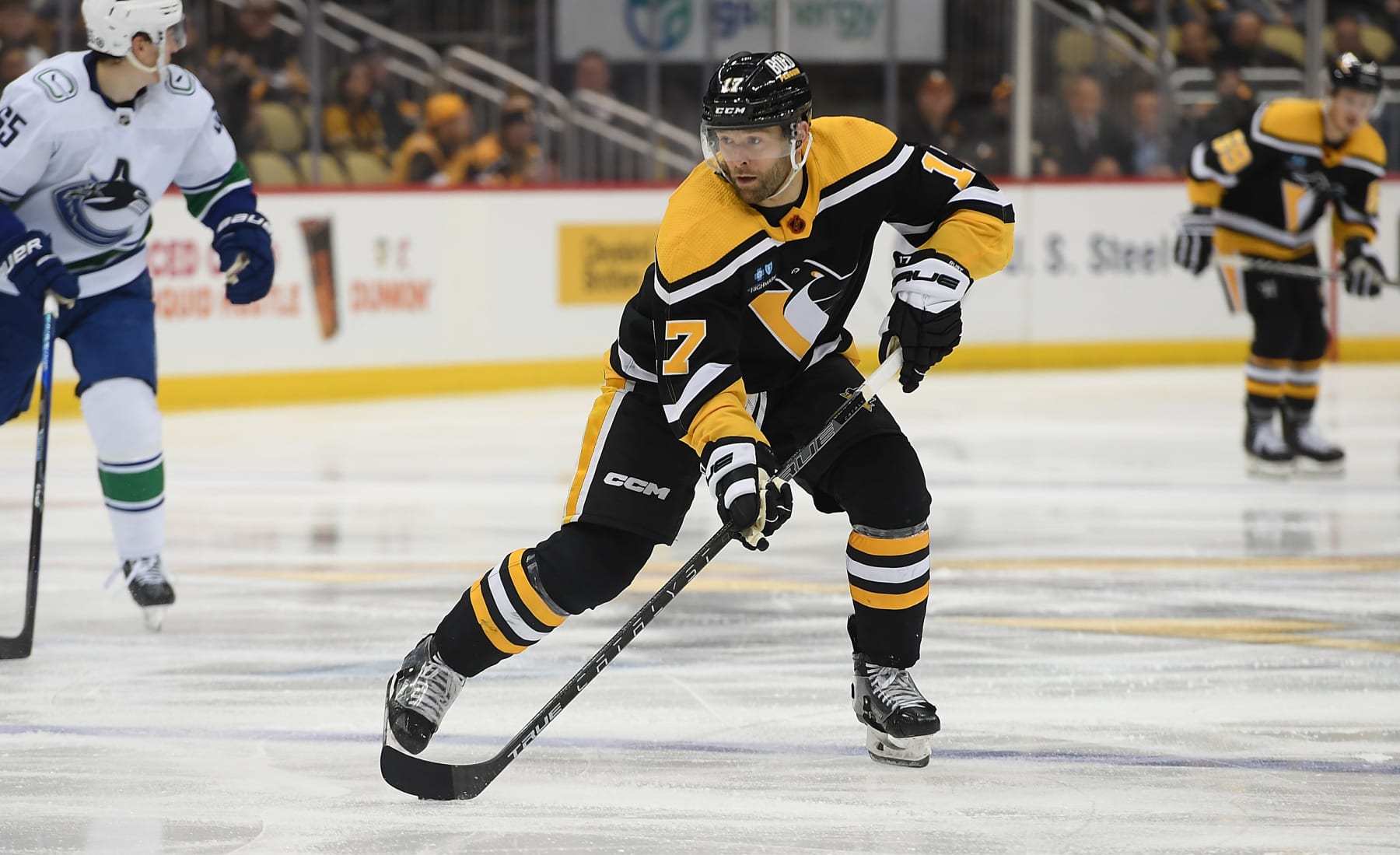 PITTSBURGH, PA - JANUARY 10: Bryan Rust #17 of the Pittsburgh Penguins skates with the puck in the third period during the game against the Vancouver Canucks at PPG PAINTS Arena on January 10, 2023 in Pittsburgh, Pennsylvania. (Photo by Justin Berl/Getty Images)