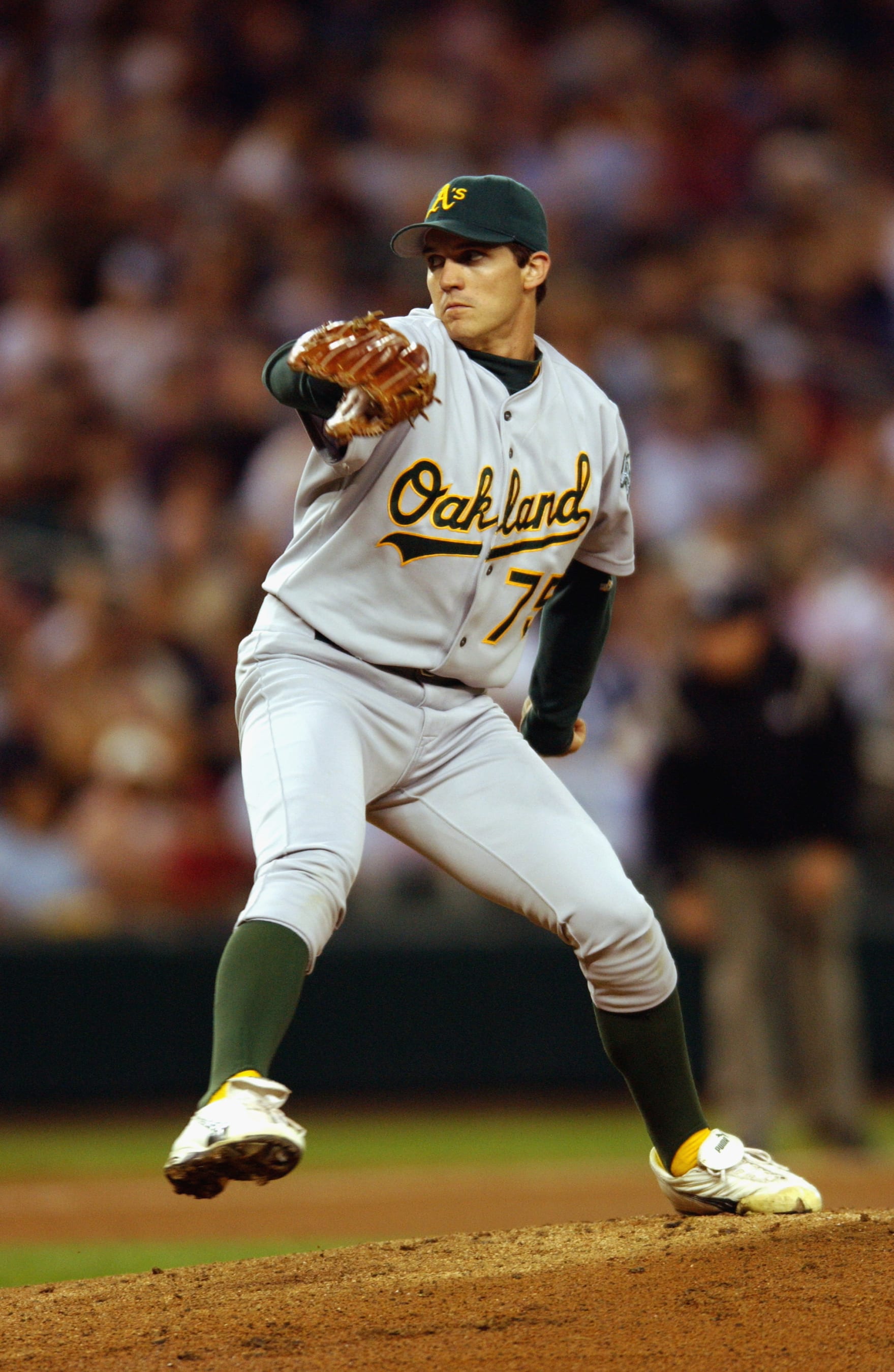 SEATTLE - SEPTEMBER 24:  Pitcher Barry Zito #75 of the Oakland Athletics throws a pitch during the MLB game against the Seattle Mariners on September 24, 2002 at Safeco Field in Seattle, Washington. The Mariners won 8-7. (Photo by Otto Greule Jr/Getty Images)