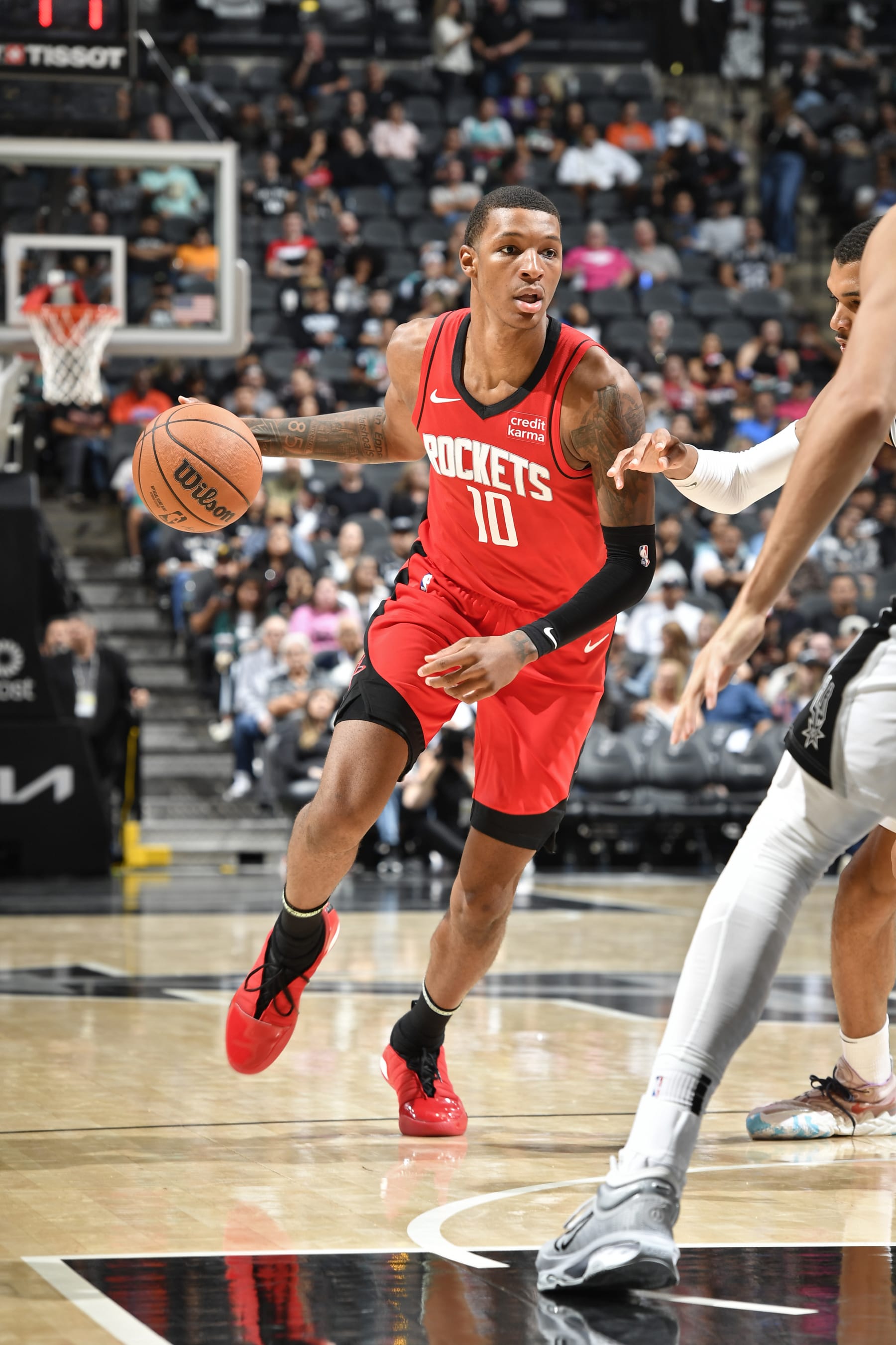 SAN ANTONIO, TX - OCTOBER 18: Jabari Smith Jr. #10 of the Houston Rockets dribbles the ball during the game against the San Antonio Spurs on October 18, 2023 at the Toyota Center in Houston, Texas. NOTE TO USER: User expressly acknowledges and agrees that, by downloading and or using this photograph, User is consenting to the terms and conditions of the Getty Images License Agreement. Mandatory Copyright Notice: Copyright 2023 NBAE (Photo by Logan Riely/NBAE via Getty Images)