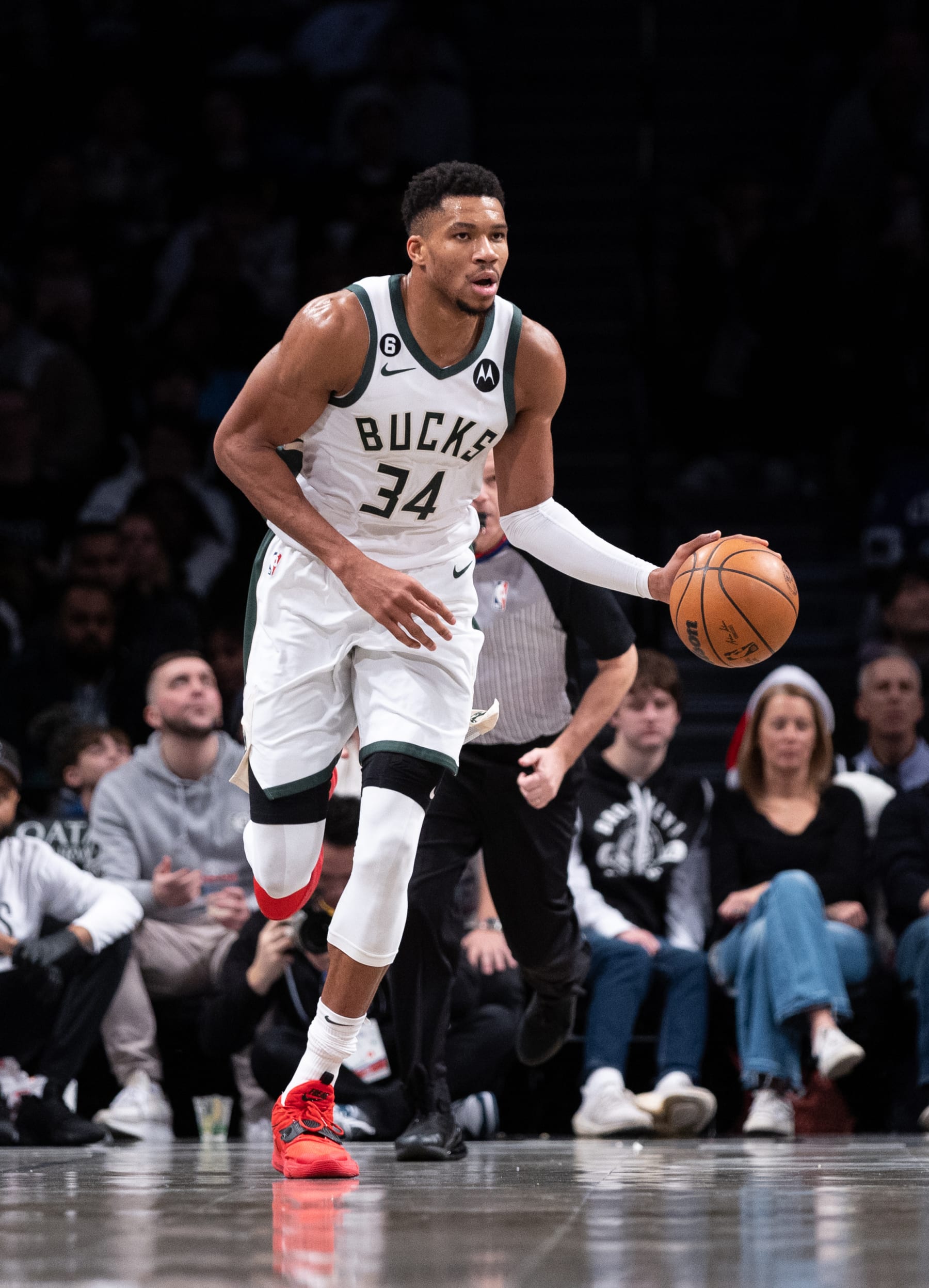 NEW YORK, NEW YORK - DECEMBER 23: Giannis Antetokounmpo #34 of the Milwaukee Bucks brings the ball up the court during the second quarter of the game against the Brooklyn Nets at Barclays Center on December 23, 2022 in New York City. NOTE TO USER: User expressly acknowledges and agrees that, by downloading and or using this photograph, User is consenting to the terms and conditions of the Getty Images License Agreement. (Photo by Dustin Satloff/Getty Images)