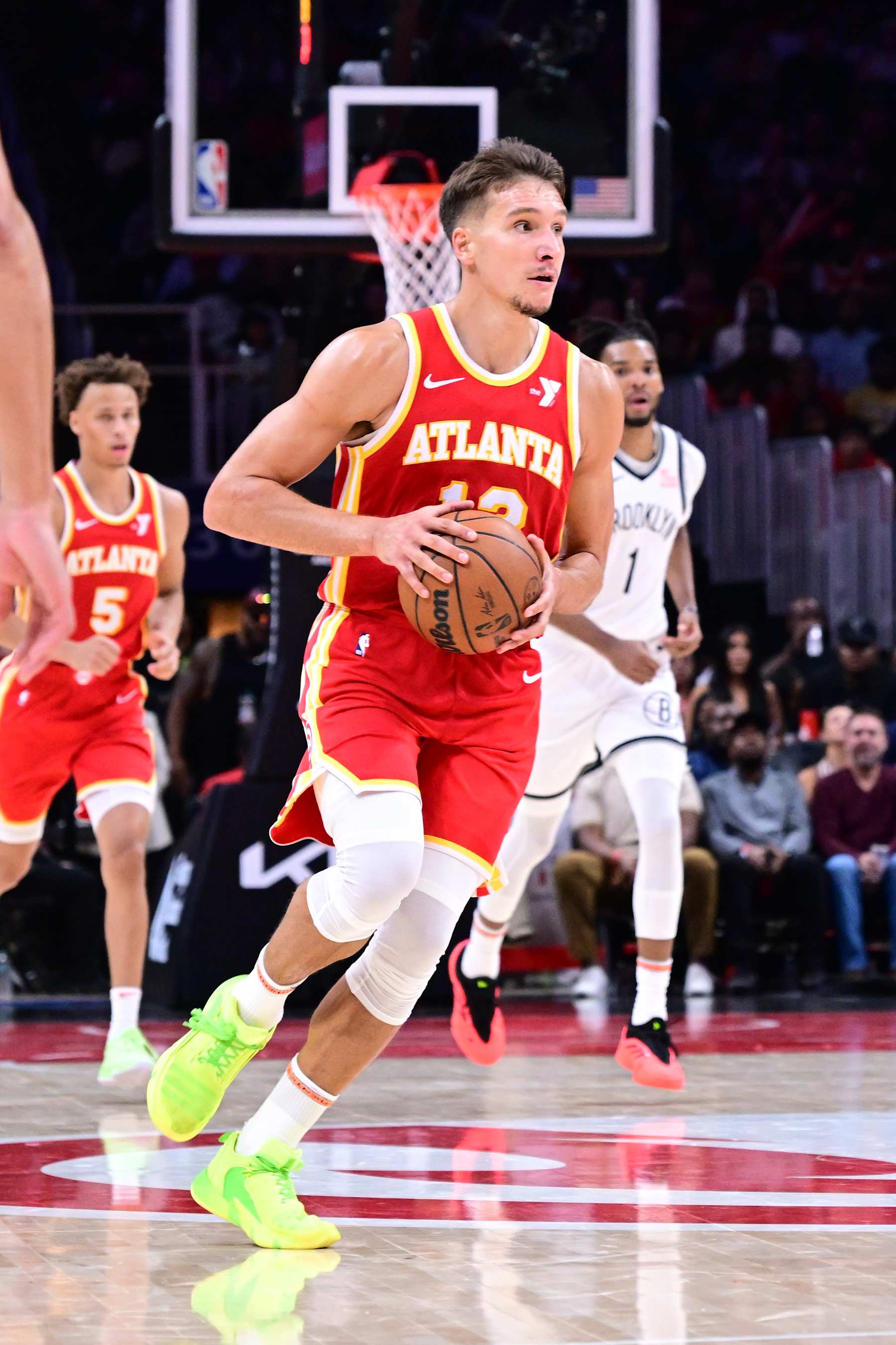 ATLANTA, GA - OCTOBER 23: Bogdan Bogdanovic #13 of the Atlanta Hawks looks to pass the ball during the game against the Brooklyn Nets on October 23, 2024 at State Farm Arena in Atlanta, Georgia.  NOTE TO USER: User expressly acknowledges and agrees that, by downloading and/or using this Photograph, user is consenting to the terms and conditions of the Getty Images License Agreement. Mandatory Copyright Notice: Copyright 2024 NBAE (Photo by Adam Hagy/NBAE via Getty Images)
