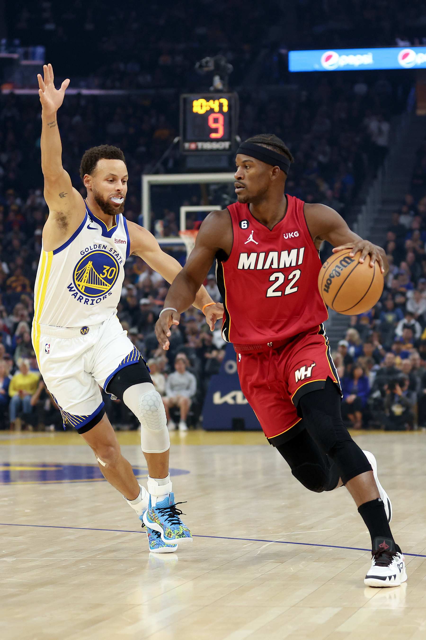 SAN FRANCISCO, CALIFORNIA - OCTOBER 27: Jimmy Butler #22 of the Miami Heat is guarded by Stephen Curry #30 of the Golden State Warriors at Chase Center on October 27, 2022 in San Francisco, California. NOTE TO USER: User expressly acknowledges and agrees that, by downloading and or using this photograph, User is consenting to the terms and conditions of the Getty Images License Agreement.  (Photo by Ezra Shaw/Getty Images)