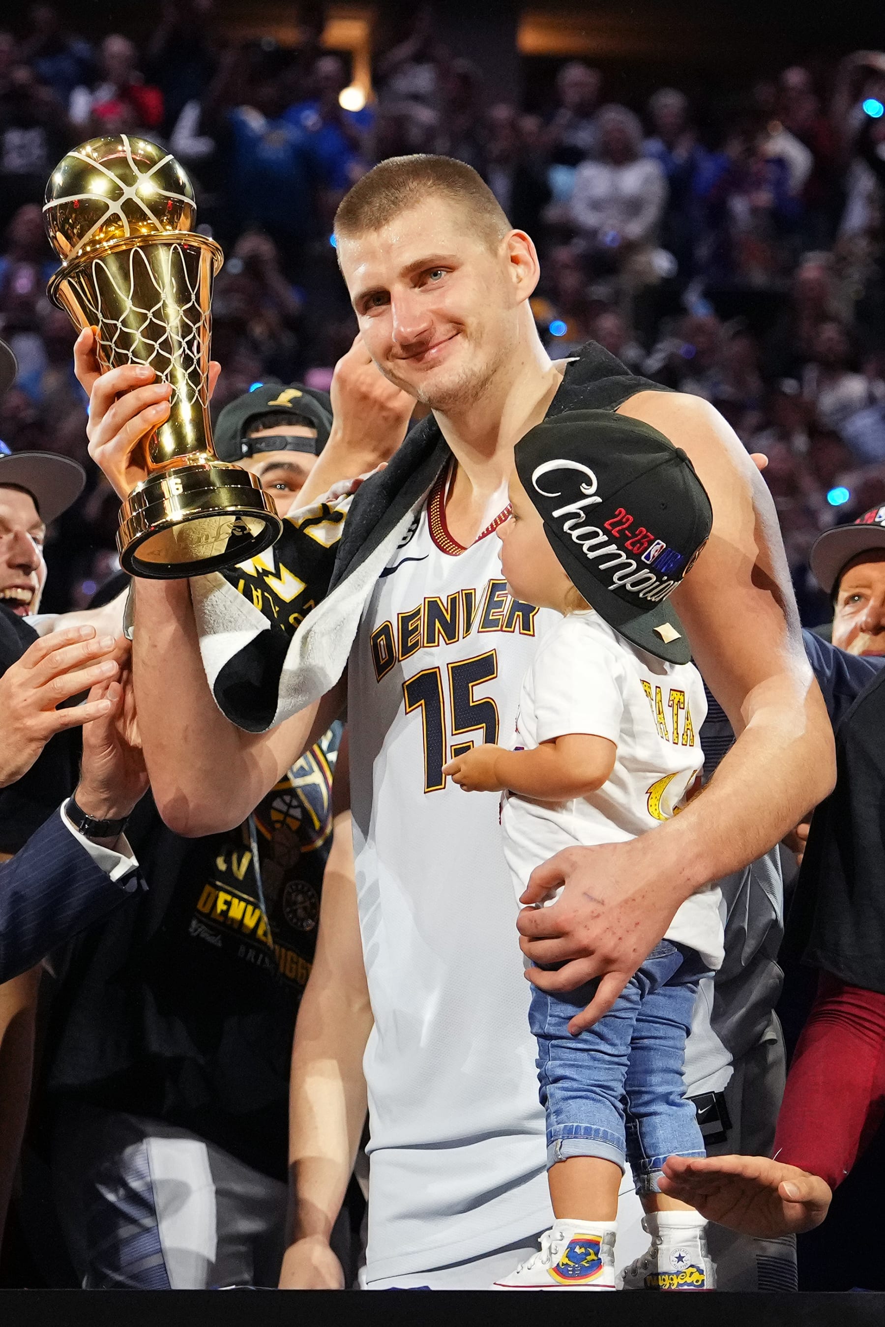 DENVER, CO - JUNE 12: Nikola Jokic #15 of the Denver Nuggets is awarded the Bill Russell MVP trophy after winning Game Five of the 2023 NBA Finals on June 12, 2023 at Ball Arena in Denver, Colorado. NOTE TO USER: User expressly acknowledges and agrees that, by downloading and or using this Photograph, user is consenting to the terms and conditions of the Getty Images License Agreement. Mandatory Copyright Notice: Copyright 2023 NBAE (Photo by Jesse D. Garrabrant/NBAE via Getty Images)