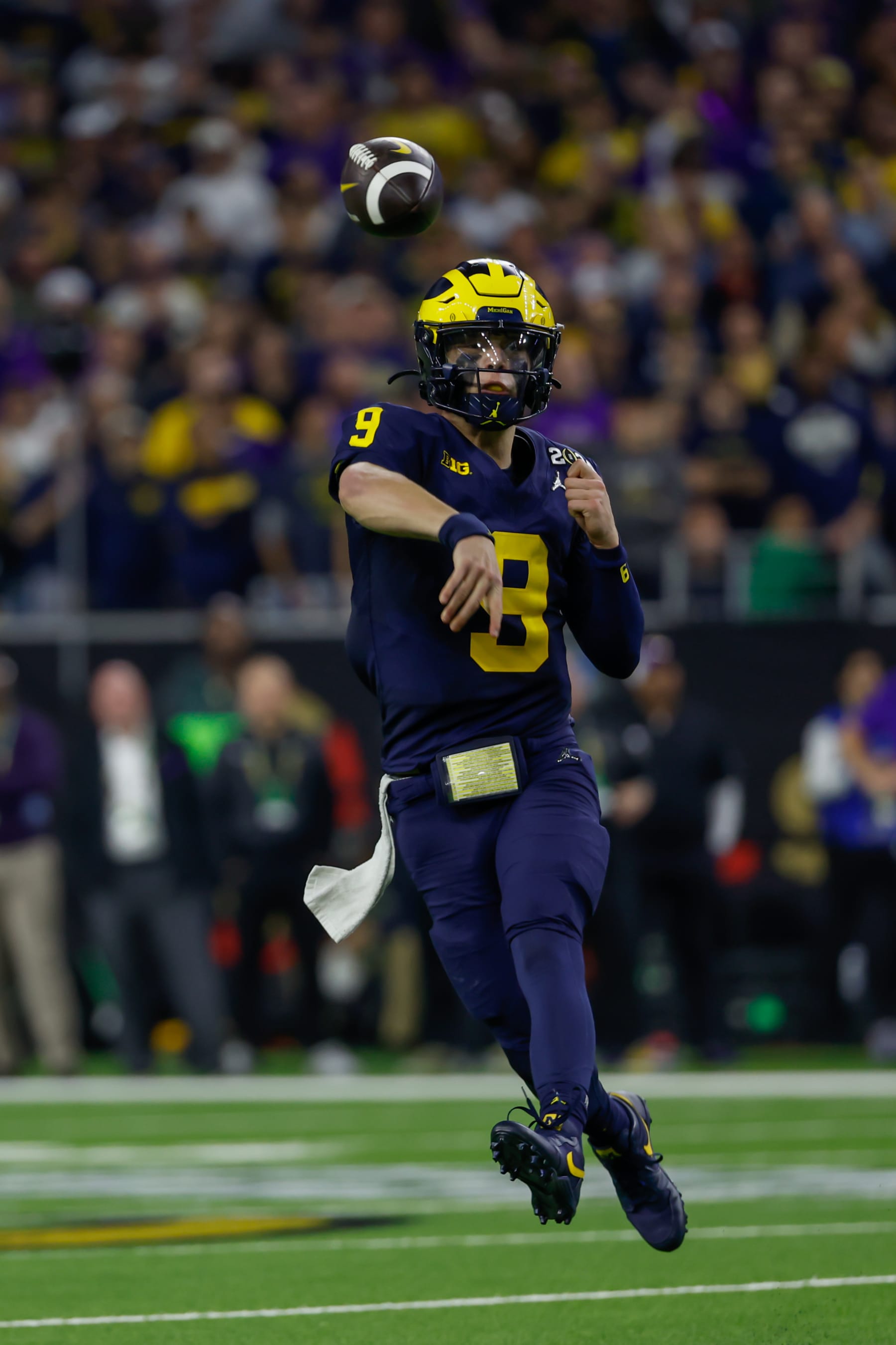 HOUSTON, TX - JANUARY 08: Michigan Wolverines quarterback J.J. McCarthy (9) passes the ball during the CFP National Championship game Michigan Wolverines and Washington Huskies on January 8, 2024, at NRG Stadium in Houston, Texas. (Photo by David Buono/Icon Sportswire via Getty Images)
