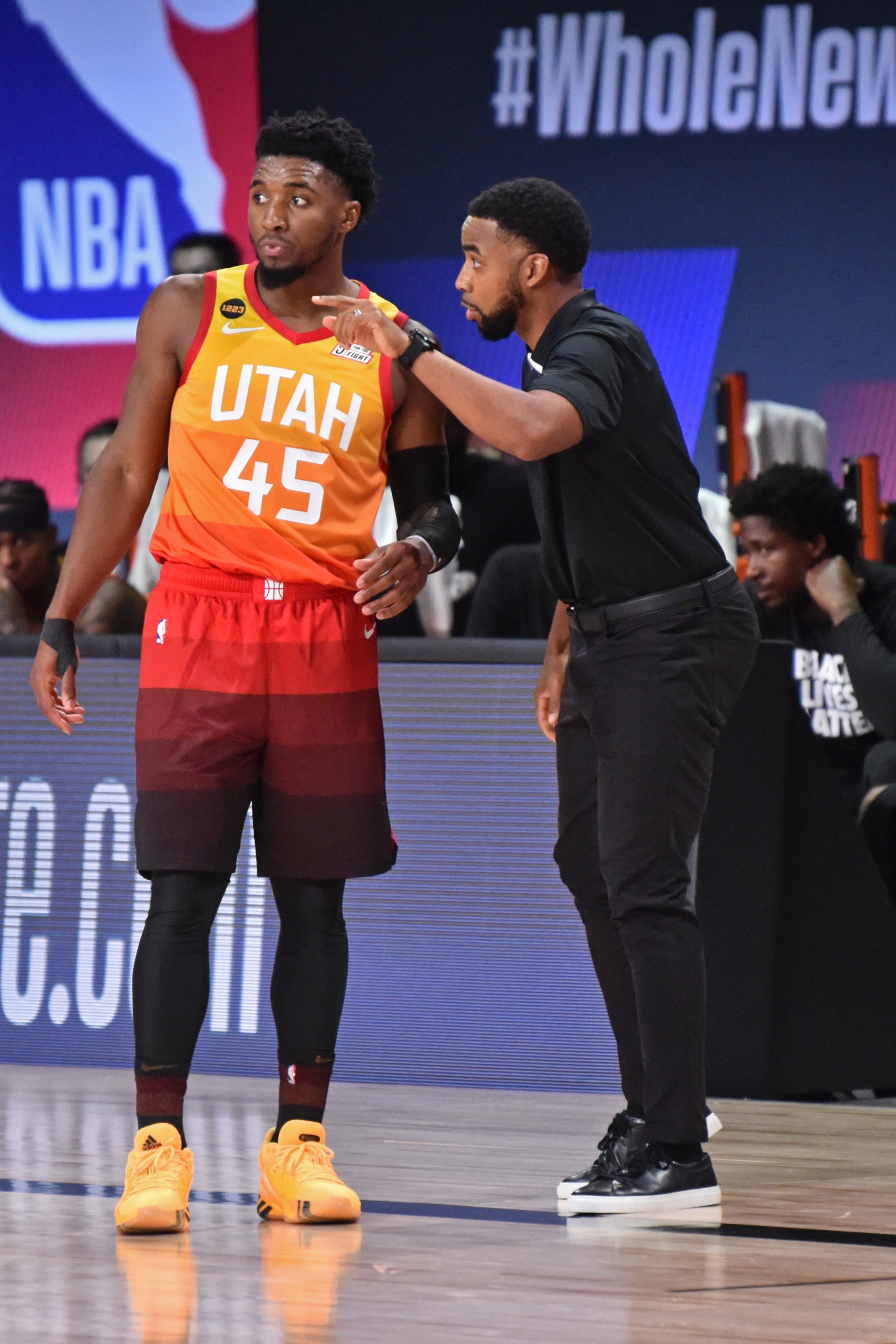 Orlando, FL - AUGUST 3: Johnnie Bryant coaches Donovan Mitchell #45 of the Utah Jazz during a game against the Los Angeles Lakers on August 3, 2020 at The Arena at ESPN Wide World Of Sports Complex in Orlando, Florida. NOTE TO USER: User expressly acknowledges and agrees that, by downloading and/or using this Photograph, user is consenting to the terms and conditions of the Getty Images License Agreement. Mandatory Copyright Notice: Copyright 2020 NBAE (Photo by David Dow/NBAE via Getty Images)