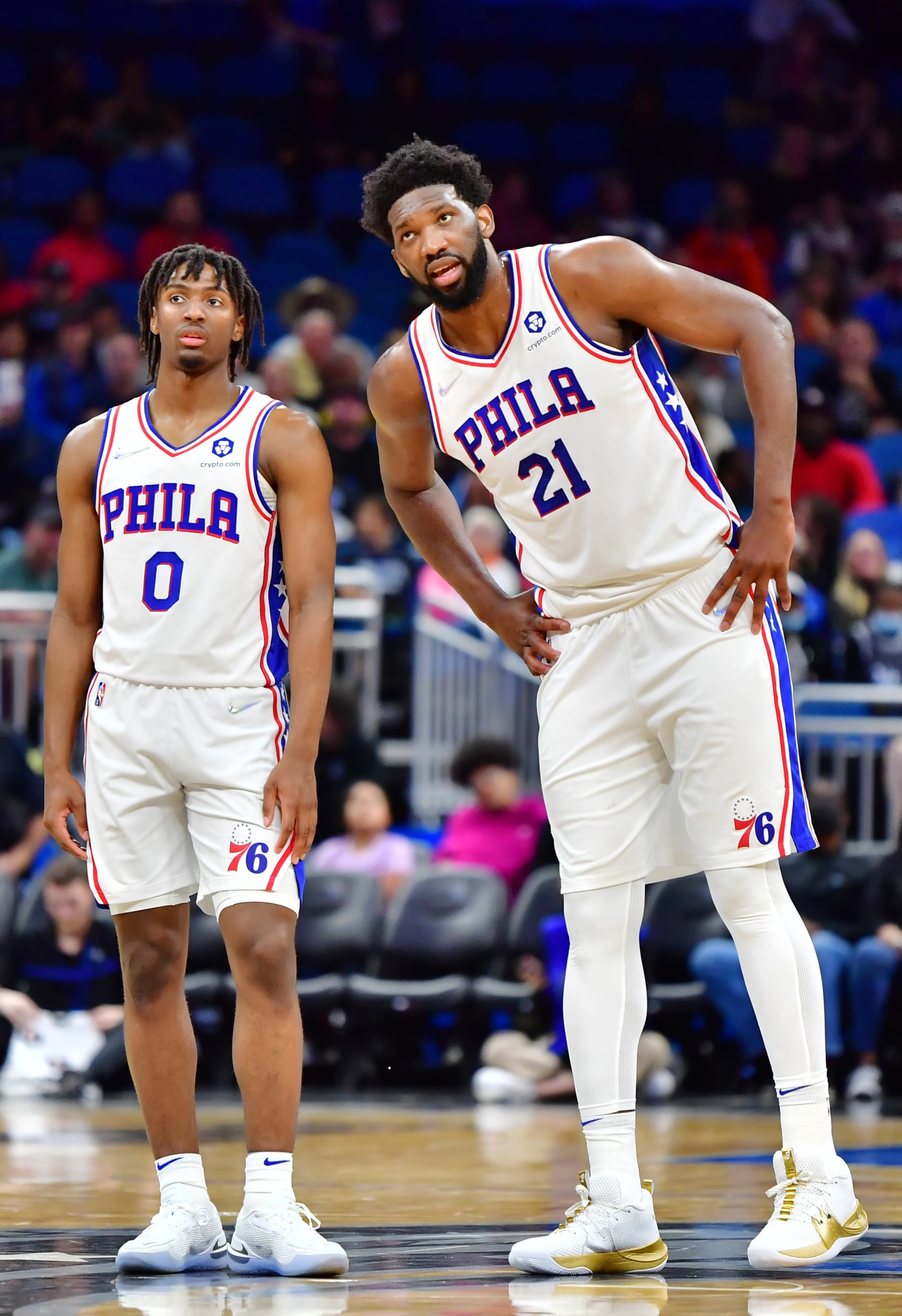 ORLANDO, FLORIDA - MARCH 13: Tyrese Maxey #0 and Joel Embiid #21 of the Philadelphia 76ers look on during the second half against the Orlando Magic at Amway Center on March 13, 2022 in Orlando, Florida. NOTE TO USER: User expressly acknowledges and agrees that, by downloading and or using this photograph, User is consenting to the terms and conditions of the Getty Images License Agreement. (Photo by Julio Aguilar/Getty Images)