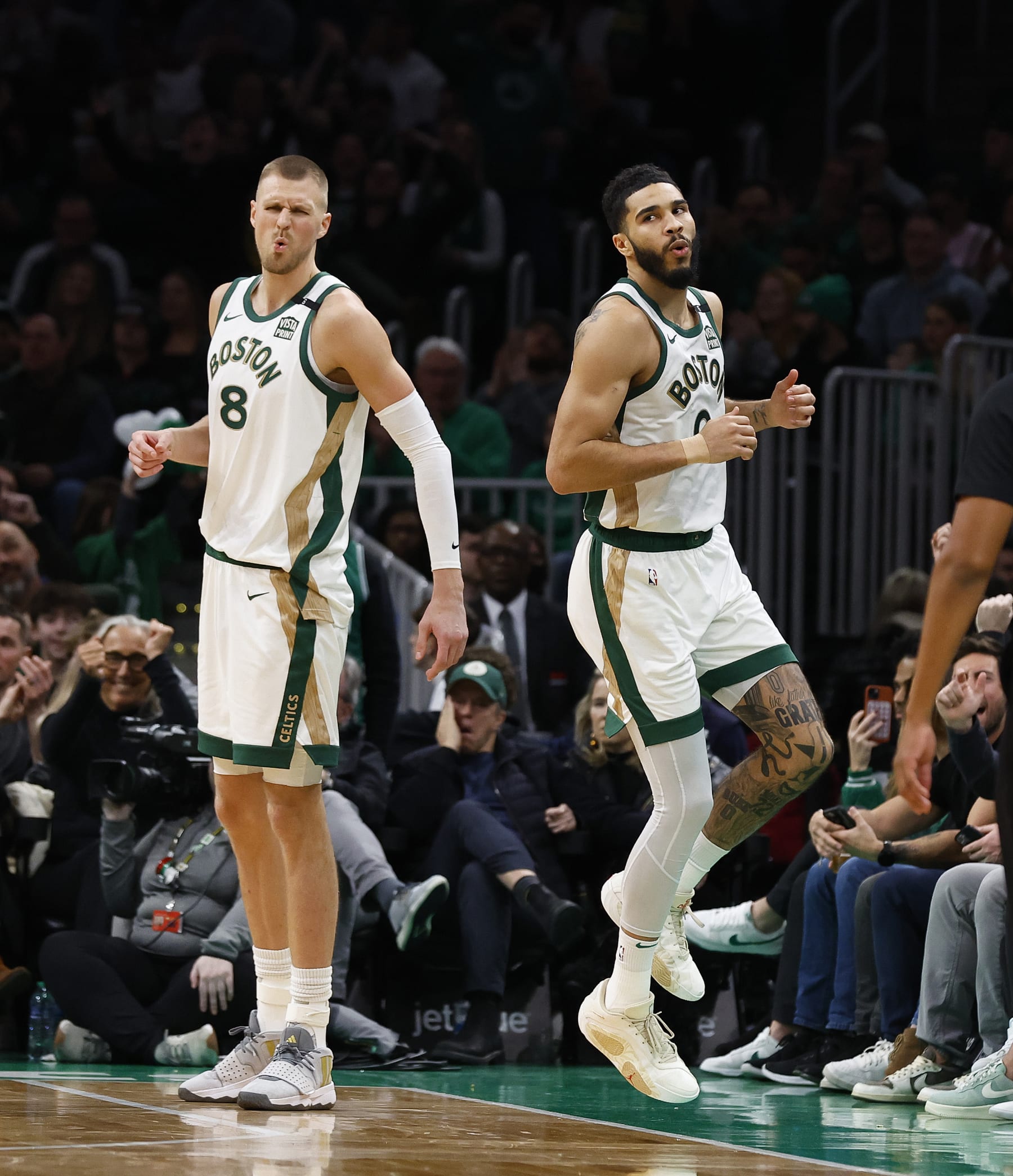 BOSTON, MA - FEBRUARY 09: Kristaps Porzingis #8 and Jayson Tatum #0 of the Boston Celtics react to Tatum's basket during the second half against the Washington Wizards at TD Garden on February 9, 2024 in Boston, Massachusetts. NOTE TO USER: User expressly acknowledges and agrees that, by downloading and/or using this Photograph, user is consenting to the terms and conditions of the Getty Images License Agreement. (Photo By Winslow Townson/Getty Images) BOSTON, MA - FEBRUARY 09: Kristaps Porzingis #8 and Jayson Tatum #0 of the Boston Celtics react to Tatum's basket during the second half against the Washington Wizards at TD Garden on February 9, 2024 in Boston, Massachusetts. NOTE TO USER: User expressly acknowledges and agrees that, by downloading and/or using this Photograph, user is consenting to the terms and conditions of the Getty Images License Agreement. (Photo By Winslow Townson/Getty Images)