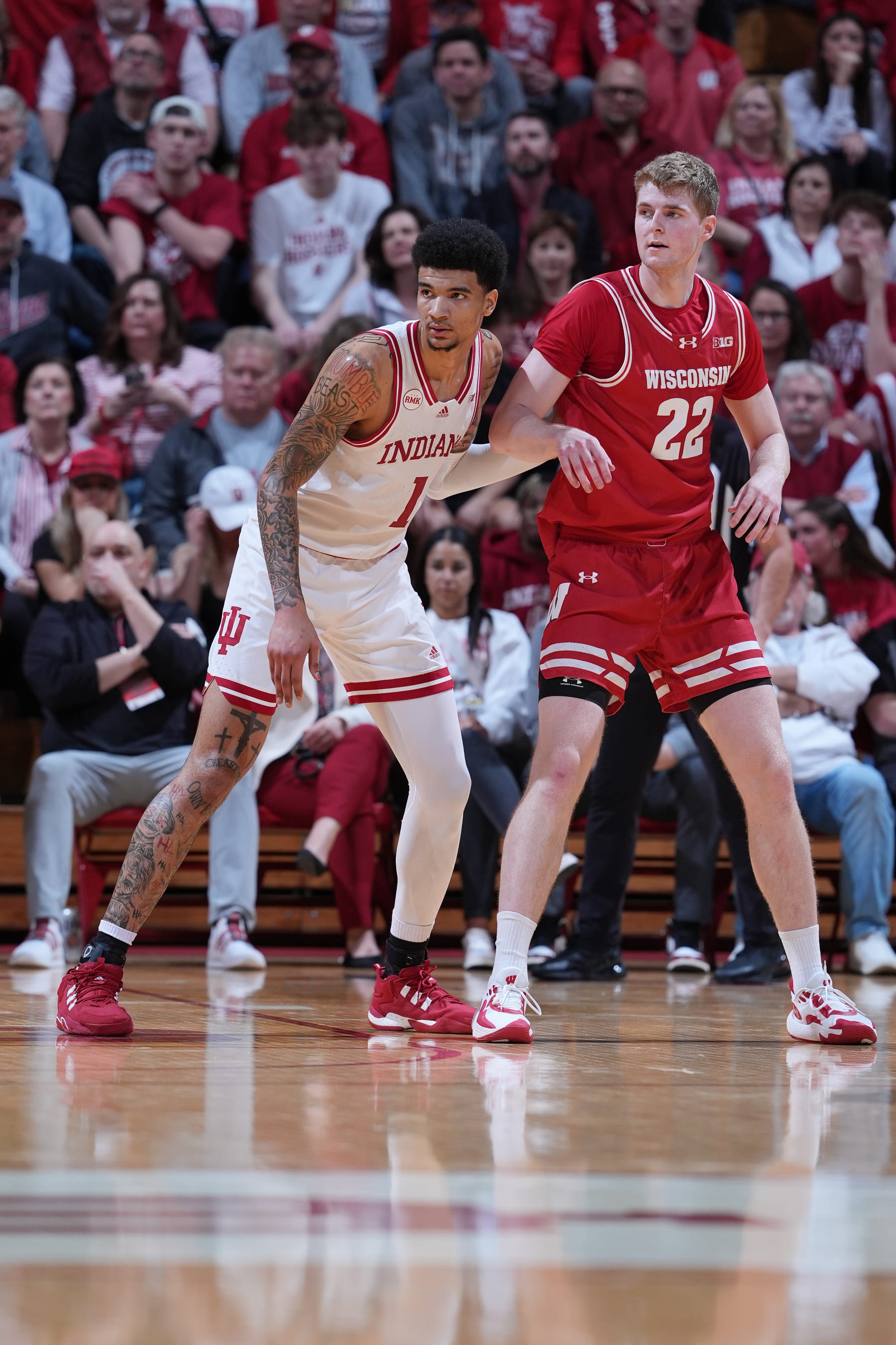 BLOOMINGTON, IN - FEBRUARY 27: Indiana Hoosiers center Kel'el Ware (1) guards Wisconsin Badgers forward Steven Crowl (22) on February 27, 2024, at Simon Skjodt Assembly Hall in Bloomington, Indiana. (Photo by Brian Spurlock/Icon Sportswire via Getty Images)