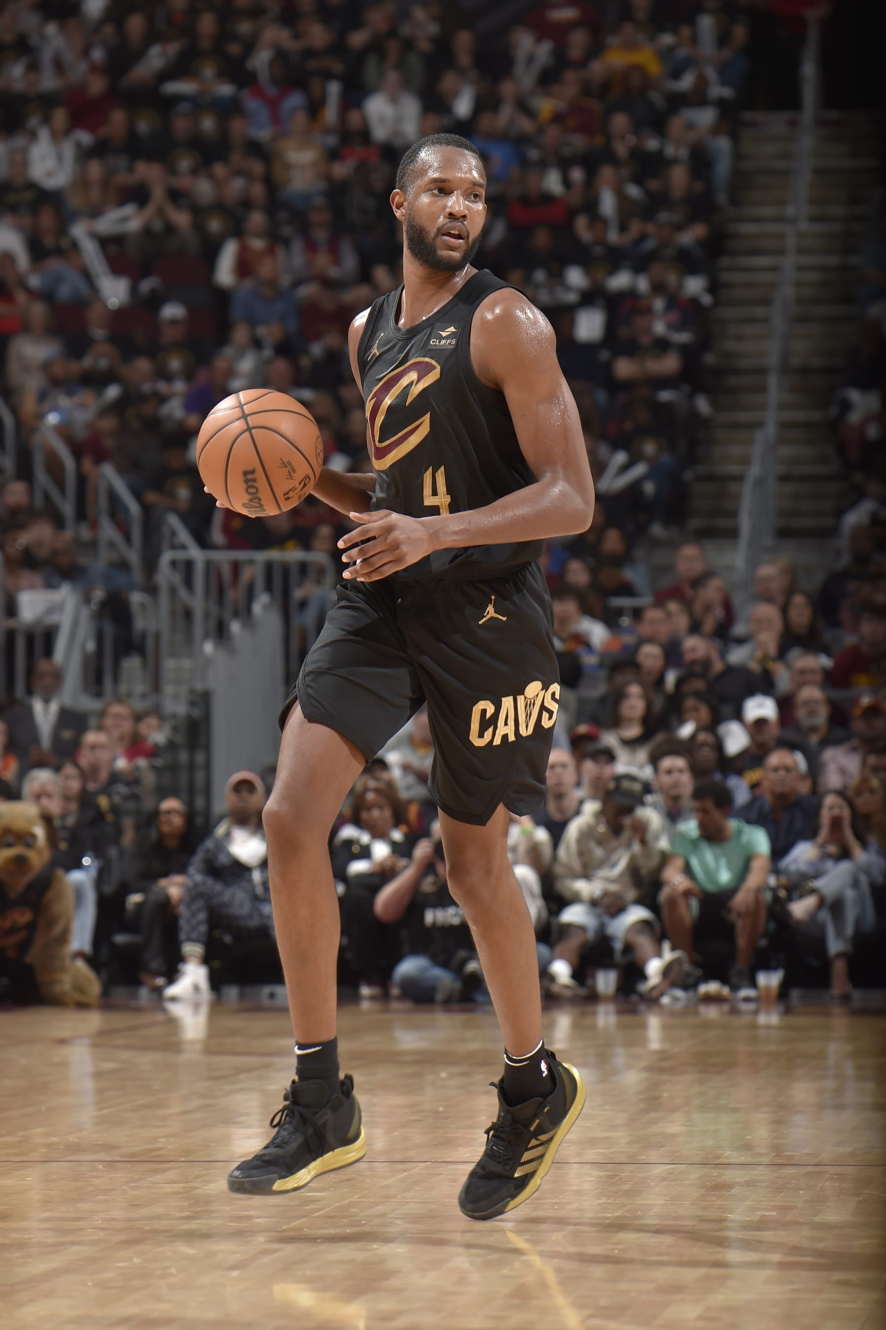CLEVELAND, OH - APRIL 30: Evan Mobley #4 of the Cleveland Cavaliers handles the ball during the game against the Orlando Magic during Round 1 Game 5 of the 2024 NBA Playoffs on April 30, 2024 at Rocket Mortgage FieldHouse in Cleveland, Ohio. NOTE TO USER: User expressly acknowledges and agrees that, by downloading and/or using this Photograph, user is consenting to the terms and conditions of the Getty Images License Agreement. Mandatory Copyright Notice: Copyright 2024 NBAE (Photo by David Liam Kyle/NBAE via Getty Images)