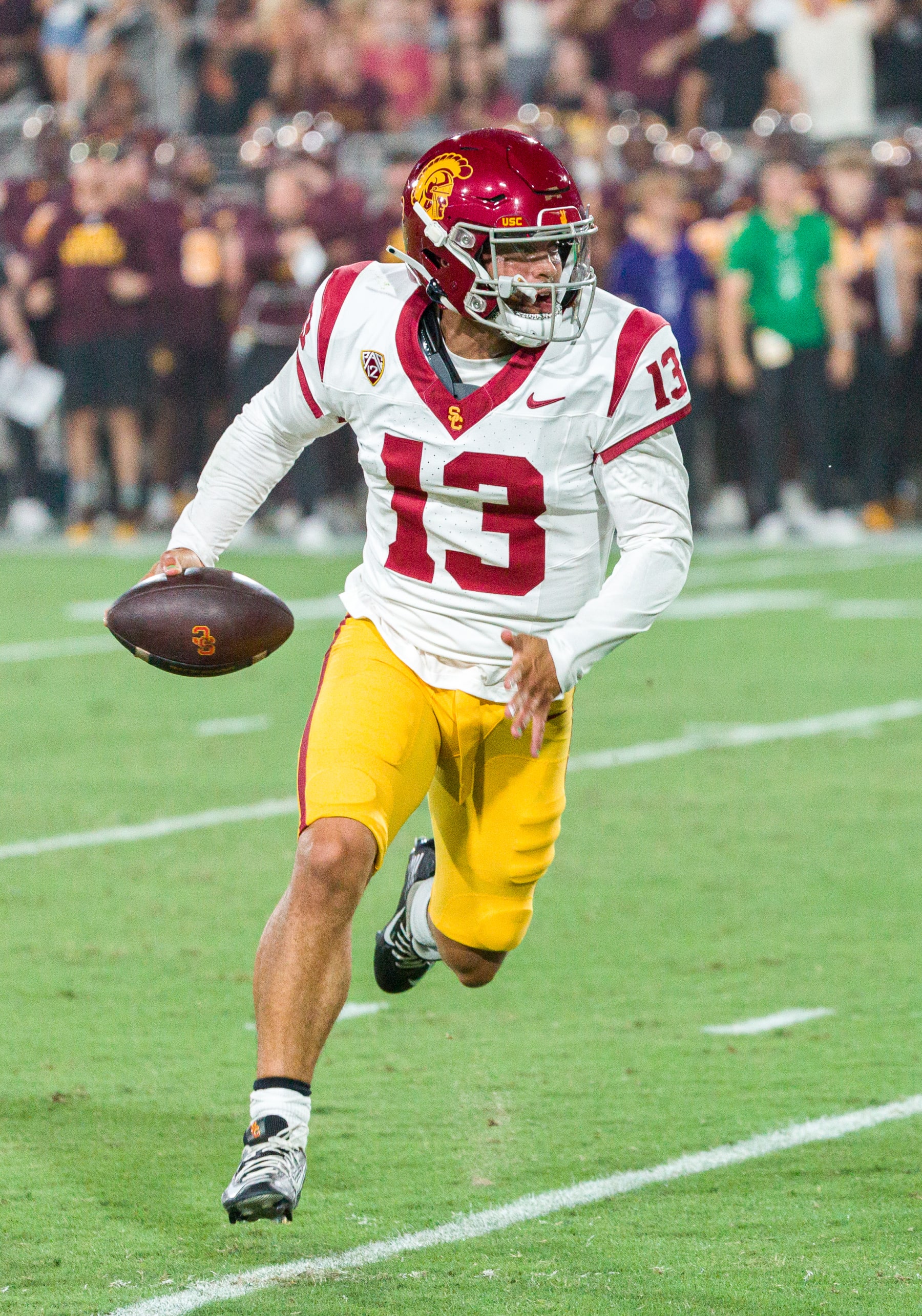 TEMPE, AZ - SEPTEMBER 23: USC Trojans quarterback Caleb Williams (13) runs to the outside during the NCAA College Football game between the USC Trojans and Arizona State Sun Devils on Saturday, September 23, 2023 at Mountain America Stadium in Tempe, Arizona. (Photo by Adam Bow/Icon Sportswire via Getty Images)