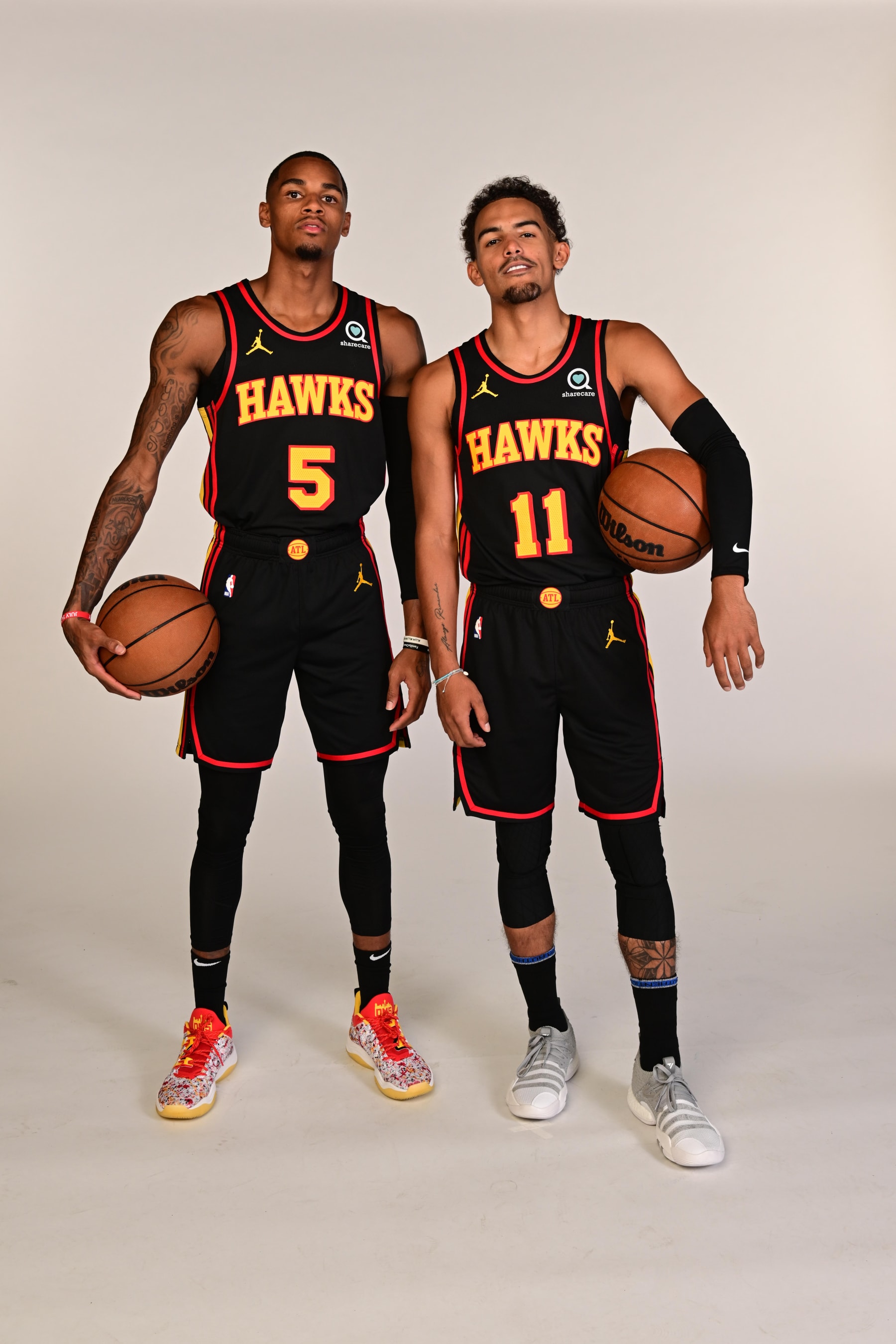 ATLANTA, GA - SEPTEMBER 23: Dejounte Murray #5 and Trae Young #11 of the Atlanta Hawks pose for a portrait during NBA Media Day on September 23, 2022 at PC&E Studio in Atlanta, Georgia. NOTE TO USER: User expressly acknowledges and agrees that, by downloading and or using this Photograph, user is consenting to the terms and conditions of the Getty Images License Agreement. Mandatory Copyright Notice: Copyright 2022 NBAE (Photo by Adam Hagy/NBAE via Getty Images)