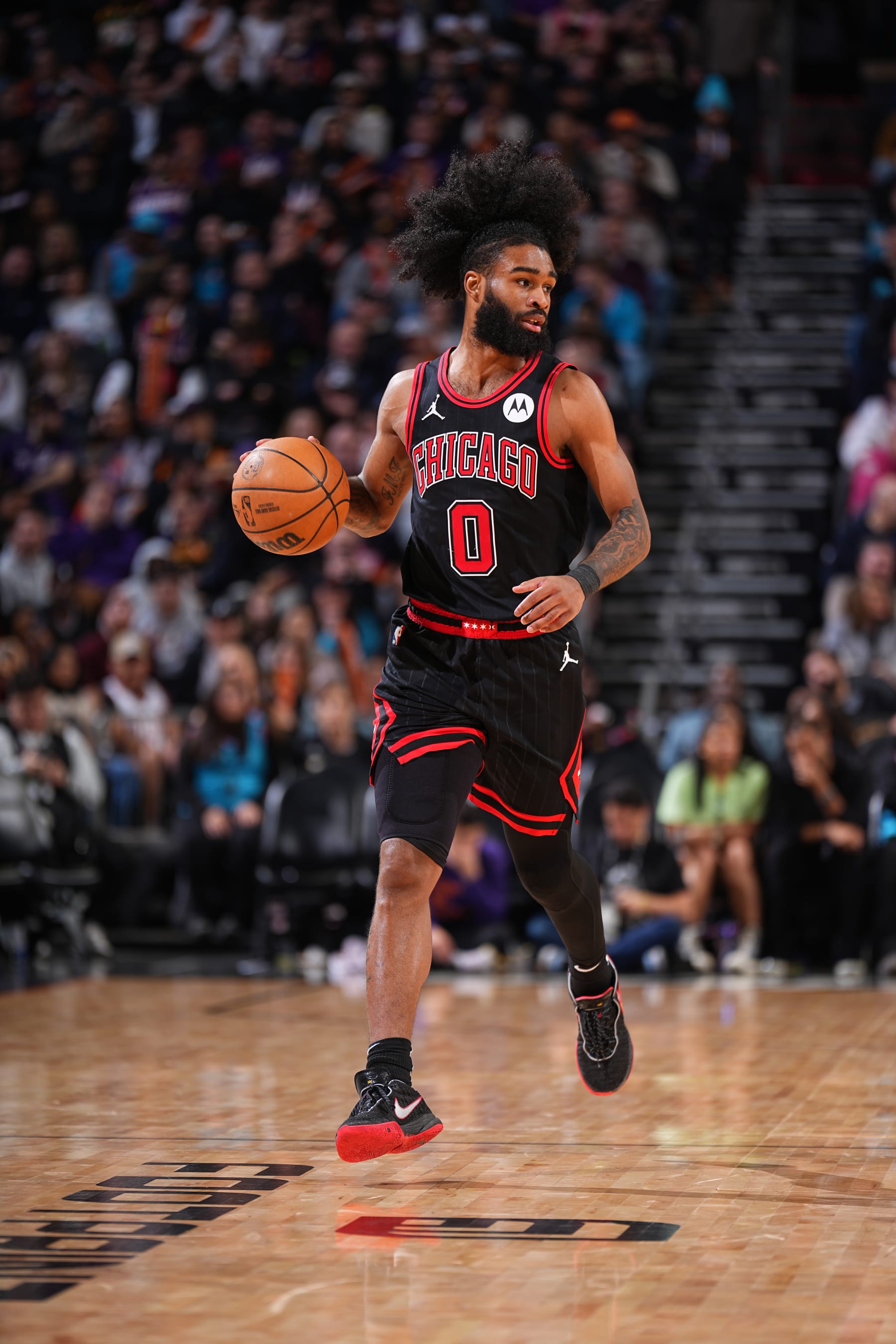 PHOENIX, AZ - JANUARY 22: Coby White #0 of the Chicago Bulls dribbles the ball during the game against the Phoenix Suns on January 22, 2024 at Footprint Center in Phoenix, Arizona. NOTE TO USER: User expressly acknowledges and agrees that, by downloading and or using this photograph, user is consenting to the terms and conditions of the Getty Images License Agreement. Mandatory Copyright Notice: Copyright 2024 NBAE (Photo by Garrett Ellwood/NBAE via Getty Images)