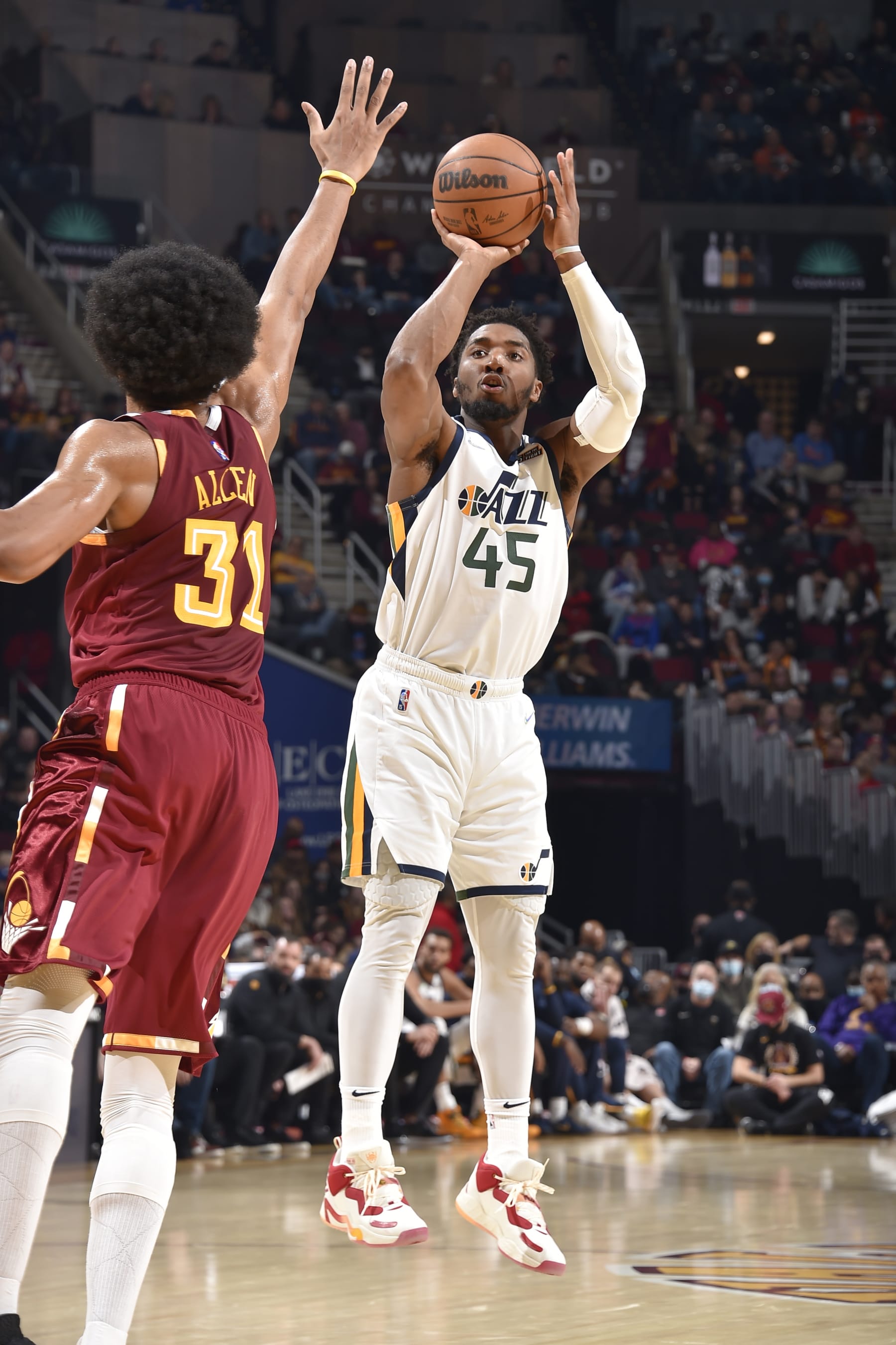 CLEVELAND, OH - DECEMBER 5: Donovan Mitchell #45 of the Utah Jazz shoots the ball during the game against the Cleveland Cavaliers on December 5, 2021 at Rocket Mortgage FieldHouse in Cleveland, Ohio. NOTE TO USER: User expressly acknowledges and agrees that, by downloading and/or using this Photograph, user is consenting to the terms and conditions of the Getty Images License Agreement. Mandatory Copyright Notice: Copyright 2021 NBAE (Photo by David Liam Kyle/NBAE via Getty Images)
