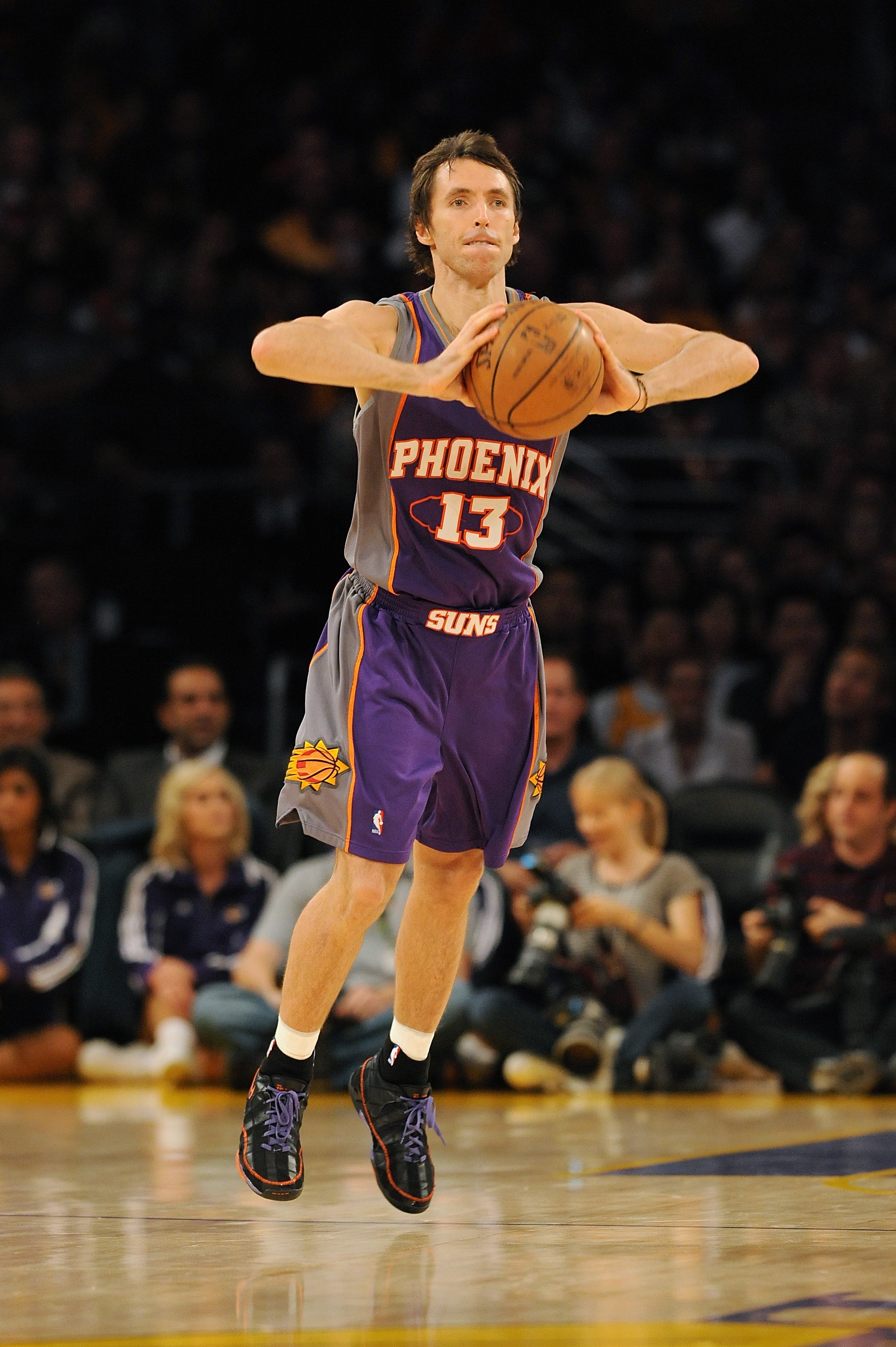 LOS ANGELES - DECEMBER 10:  Steve Nash #13 of the Phoenix Suns passes the ball during the game against the Los Angeles Lakers on December 10, 2008 at Staples Center in Los Angeles, California.  The Lakers won 115-110.  NOTE TO USER: User expressly acknowledges and agrees that, by downloading and/or using this Photograph, user is consenting to the terms and conditions of the Getty Images License Agreement. Mandatory Copyright Notice: Copyright 2008 NBAE  (Photo by Noah Graham/NBAE via Getty Images)