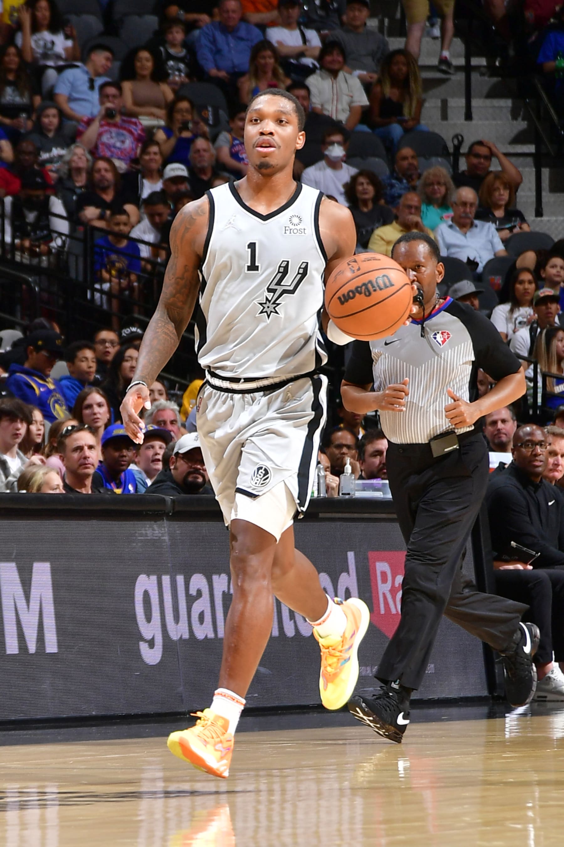 SAN ANTONIO, TX -APRIL 9: Lonnie Walker IV #1 of the San Antonio Spurs dribbles the ball during the game against the Golden State Warriors on April 9, 2022 at the AT&T Center in San Antonio, Texas. NOTE TO USER: User expressly acknowledges and agrees that, by downloading and or using this photograph, user is consenting to the terms and conditions of the Getty Images License Agreement. Mandatory Copyright Notice: Copyright 2022 NBAE (Photos by Michael Gonzales/NBAE via Getty Images)