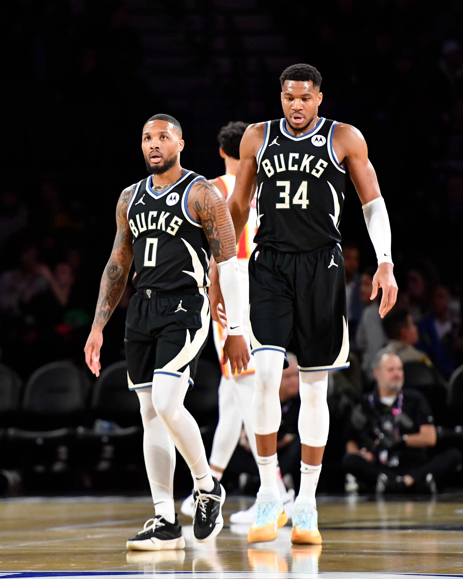 LAS VEGAS, NV - DECEMBER 14: Damian Lillard #0 and Giannis Antetokounmpo #34 of the Milwaukee Bucks looks on during the game against the Atlanta Hawks during the Emirates NBA Cup Eastern Semifinals on December 14, 2024 at the T-Mobile Arena in Las Vegas, Nevada. NOTE TO USER: User expressly acknowledges and agrees that, by downloading and or using this photograph, User is consenting to the terms and conditions of the Getty Images License Agreement. Mandatory Copyright Notice: Copyright 2024 NBAE (Photo by Logan Riely/NBAE via Getty Images)