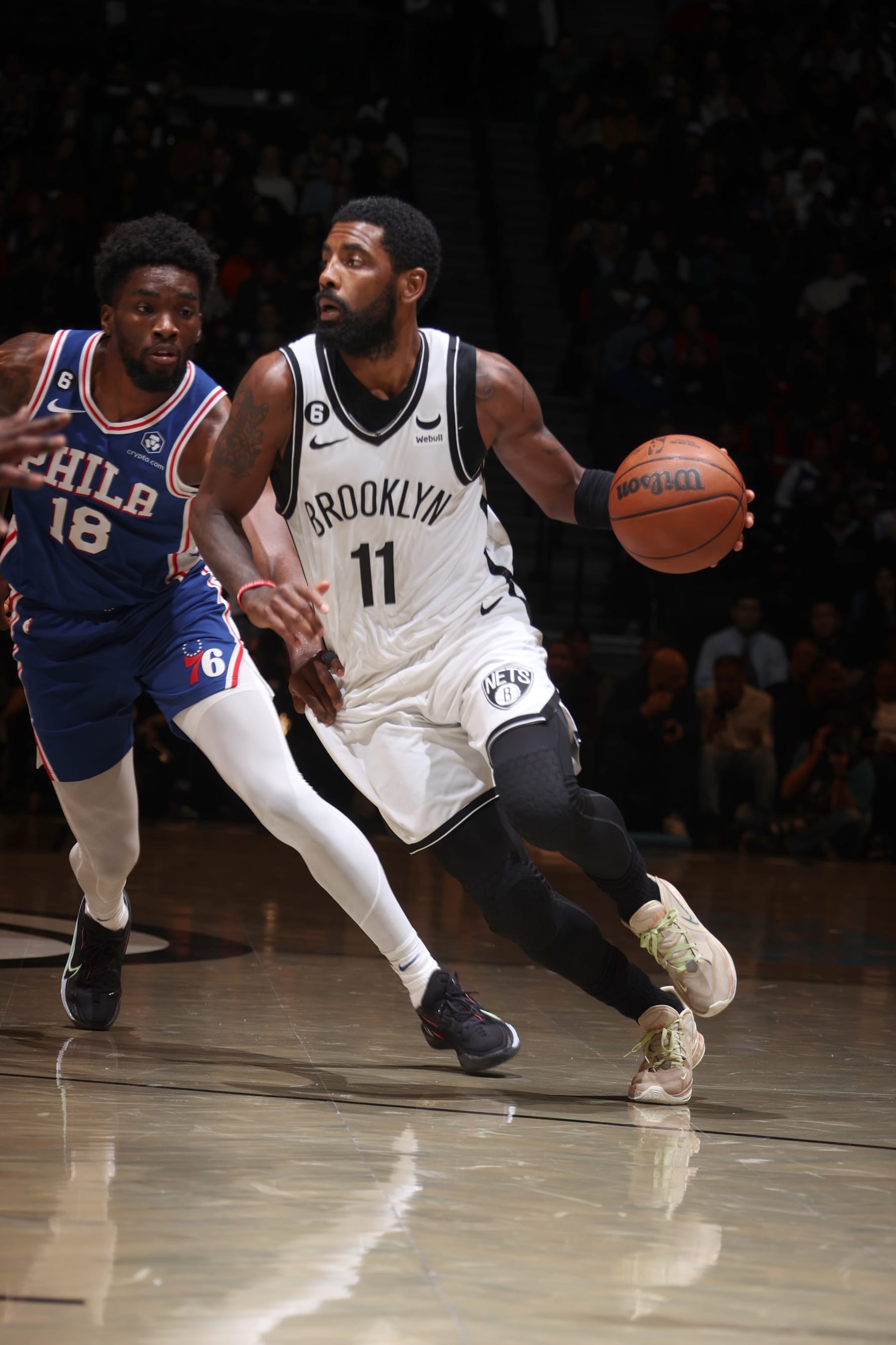 BROOKLYN, NY - OCTOBER 3: Kyrie Irving #11 of the Brooklyn Nets dribbles the ball against the Philadelphia 76ers during a preseason game on October 3, 2022 at Barclays Center in Brooklyn, New York. NOTE TO USER: User expressly acknowledges and agrees that, by downloading and or using this Photograph, user is consenting to the terms and conditions of the Getty Images License Agreement. Mandatory Copyright Notice: Copyright 2022 NBAE (Photo by Nathaniel S. Butler/NBAE via Getty Images)