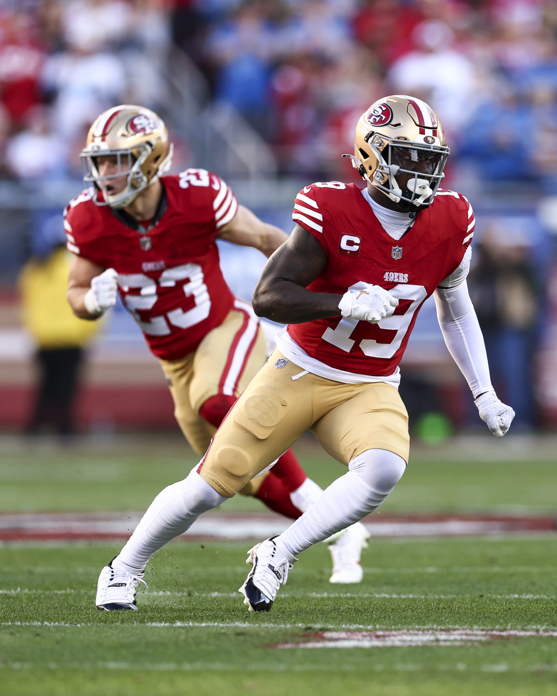 SANTA CLARA, CA - JANUARY 28: Deebo Samuel #19 and Christian McCaffrey #23 of the San Francisco 49ers run downfield during the NFC Championship NFL football game against the Detroit Lions at Levi's Stadium on January 28, 2024 in Santa Clara, California. (Photo by Kevin Sabitus/Getty Images)