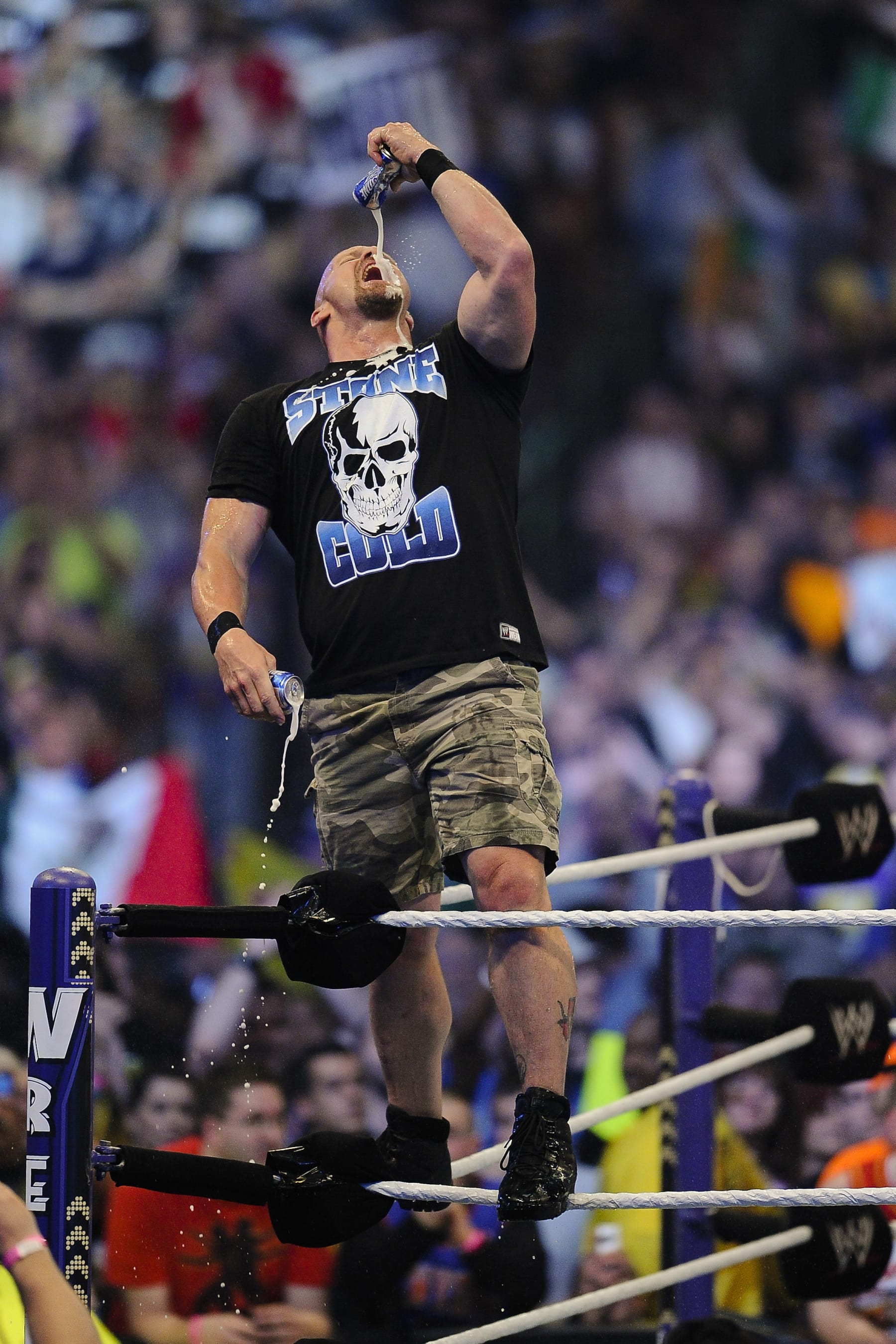 WWE Superstars Stone Cold Steve Austin plays to the crowd during WrestleMania XXVII at the Georgia Dome in Atlanta, Georgia on Sunday, April 3, 2011. (Paul Abell/AP Images for WWE)