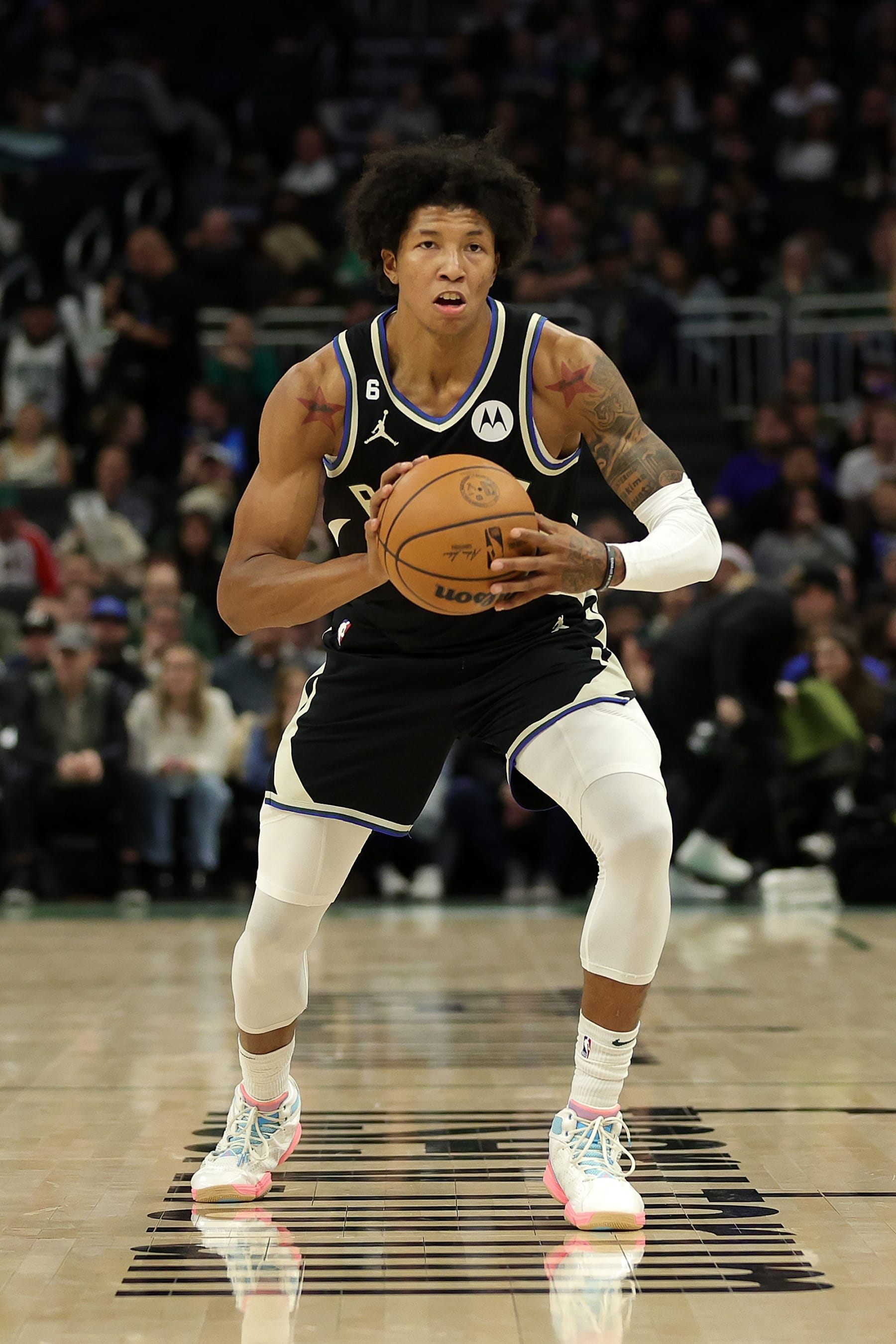 MILWAUKEE, WISCONSIN - DECEMBER 17: MarJon Beauchamp #0 of the Milwaukee Bucks handles the ball during a game against the Utah Jazz at Fiserv Forum on December 17, 2022 in Milwaukee, Wisconsin. NOTE TO USER: User expressly acknowledges and agrees that, by downloading and or using this photograph, User is consenting to the terms and conditions of the Getty Images License Agreement. (Photo by Stacy Revere/Getty Images)
