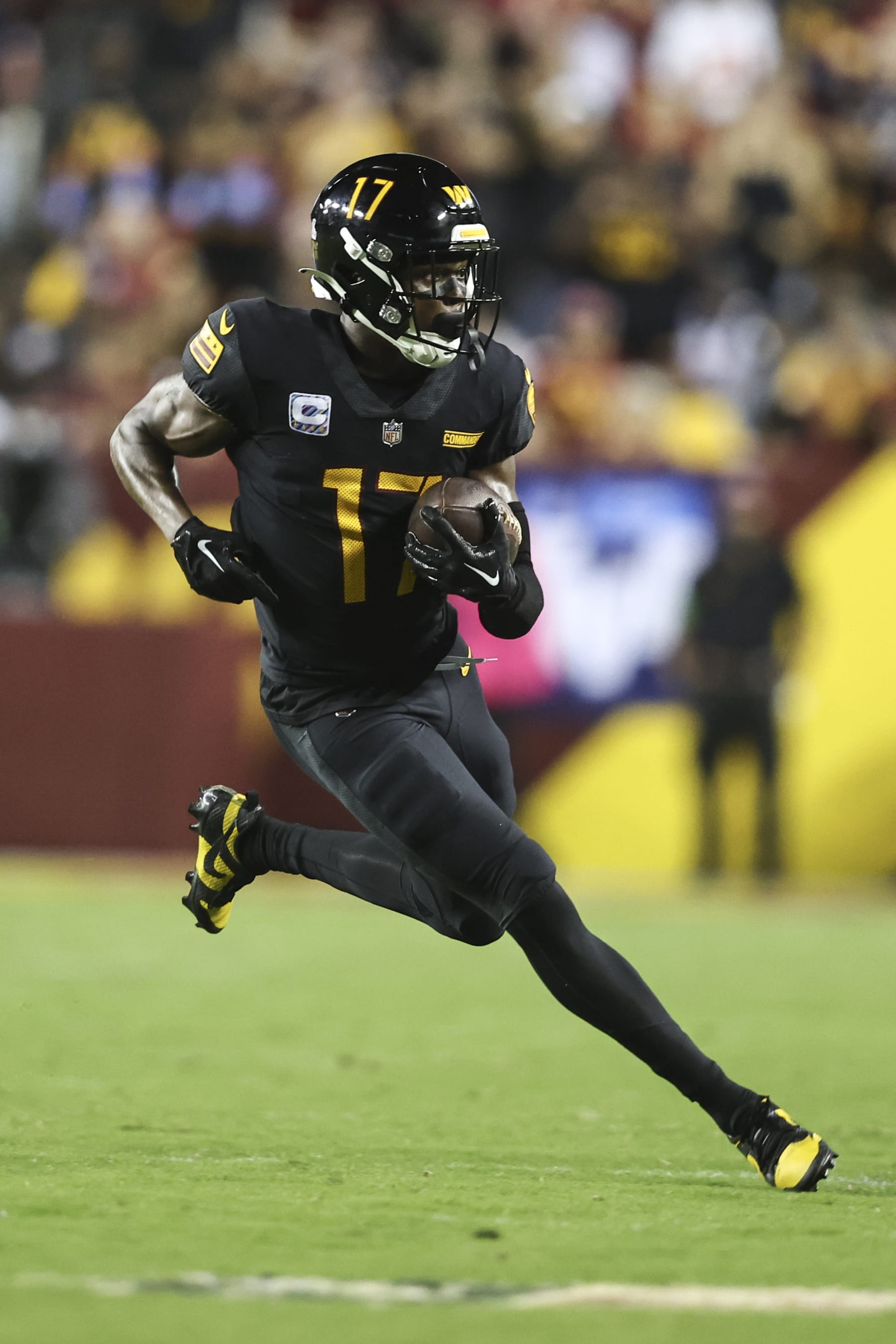 LANDOVER, MARYLAND - OCTOBER 05: Terry McLaurin #17 of the Washington Commanders runs with the ball during an NFL football game between the Washington Commanders and the Chicago Bears at FedExField on October 05, 2023 in Landover, Maryland. (Photo by Michael Owens/Getty Images)