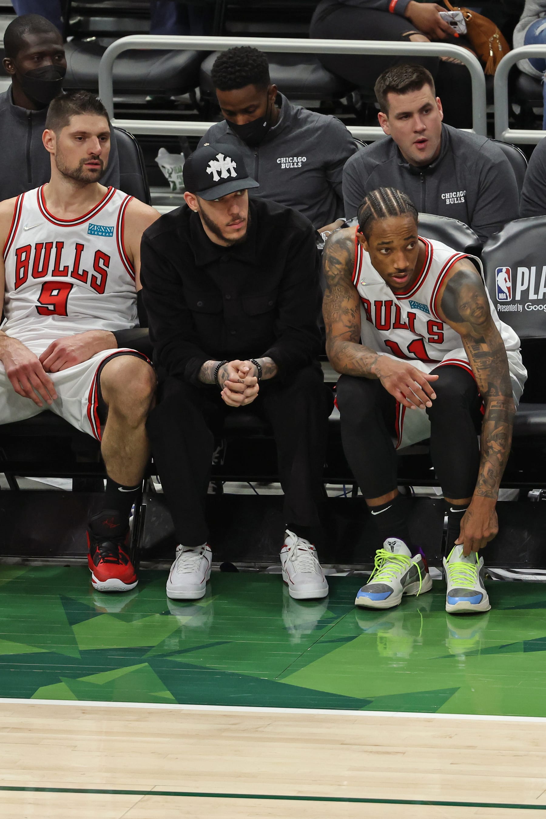 CHICAGO, IL - APRIL 27:  Nikola Vucevic #9 of the Chicago Bulls, Lonzo Ball #2 and DeMar DeRozan #11 sits on the bench during Round 1 Game 5 of the 2022 NBA Playoffs against   on April 27, 2022 at United Center in Chicago, Illinois. NOTE TO USER: User expressly acknowledges and agrees that, by downloading and or using this photograph, User is consenting to the terms and conditions of the Getty Images License Agreement. Mandatory Copyright Notice: Copyright 2022 NBAE (Photo by Jeff Haynes/NBAE via Getty Images)