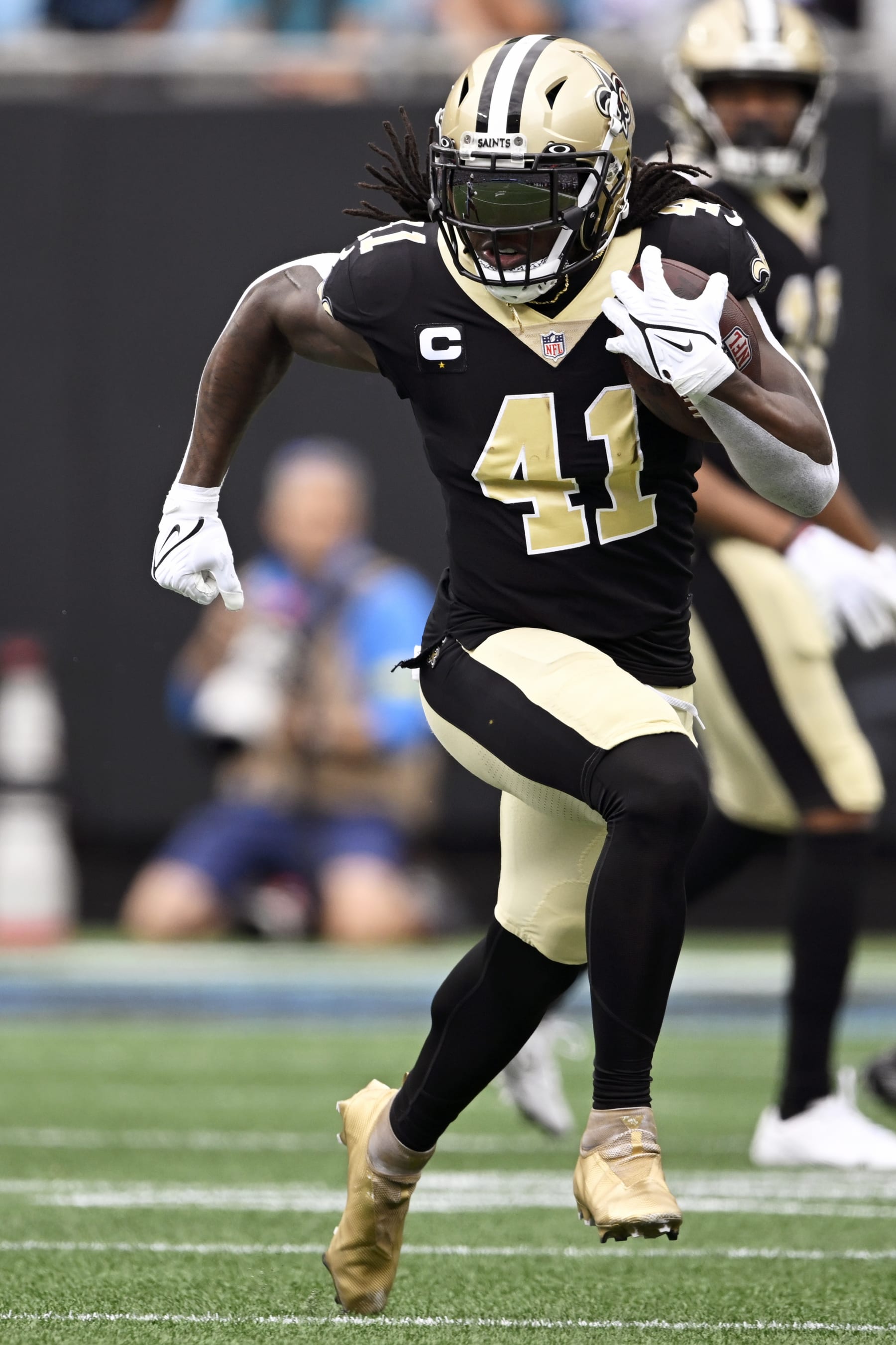 CHARLOTTE, NORTH CAROLINA - SEPTEMBER 25: Alvin Kamara #41 of the New Orleans Saints runs the ball against the Carolina Panthers in the first quarter at Bank of America Stadium on September 25, 2022 in Charlotte, North Carolina. (Photo by Eakin Howard/Getty Images)