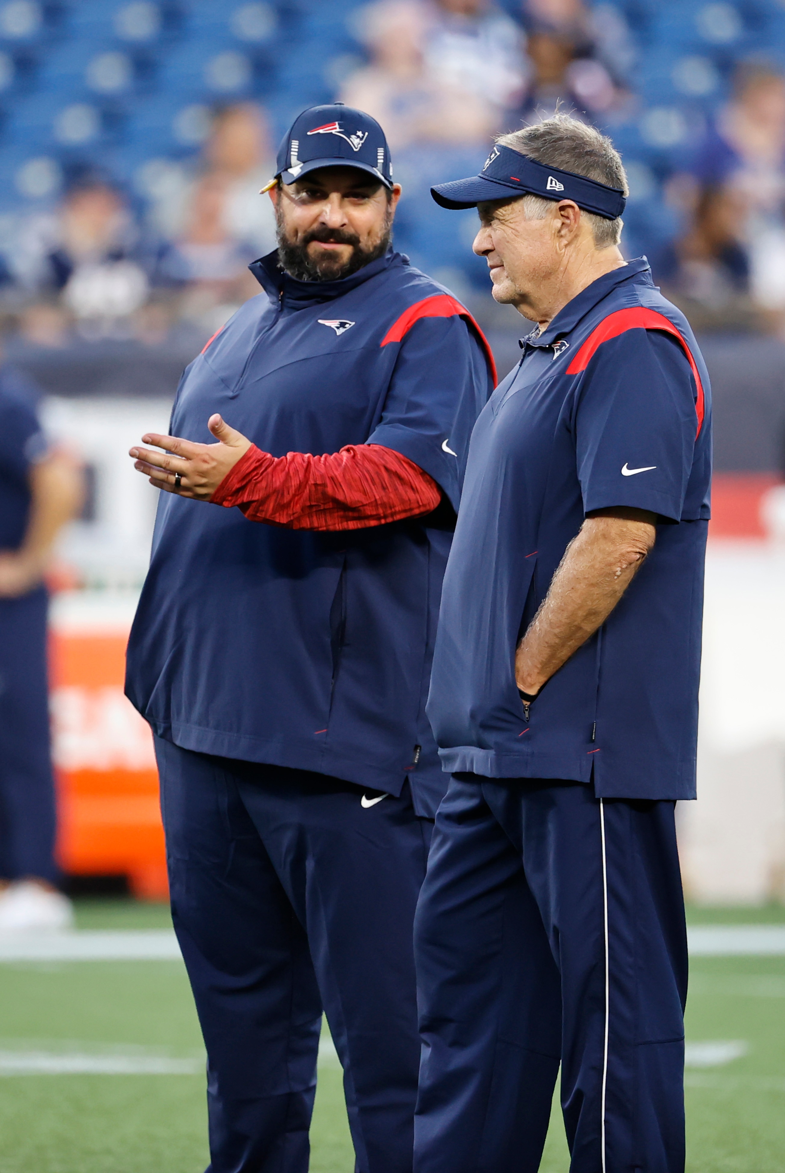 FOXBOROUGH, MA - AUGUST 12: New England Patriots senior football advisor Matt Patricia talks to New England Patriots head coach Bill Belichick in warm up before a preseason game between the New England Patriots and the Washington Football Team on August 12, 2021, at Gillette Stadium in Foxborough, Massachusetts. (Photo by Fred Kfoury III/Icon Sportswire via Getty Images)
