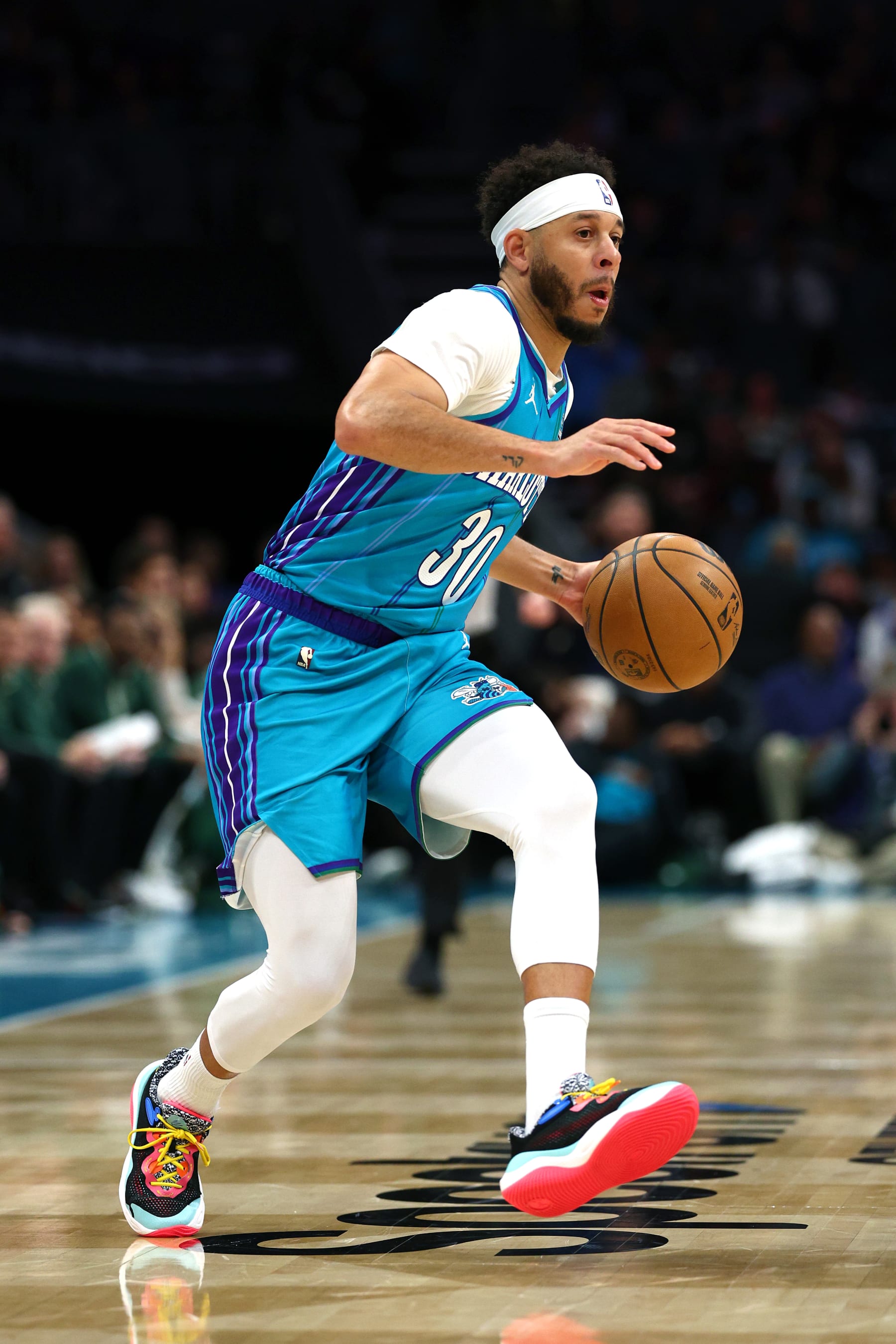 CHARLOTTE, NORTH CAROLINA - FEBRUARY 29: Seth Curry #30 of the Charlotte Hornets dribbles during the first half of the game against the Milwaukee Bucks at Spectrum Center on February 29, 2024 in Charlotte, North Carolina. NOTE TO USER: User expressly acknowledges and agrees that, by downloading and or using this photograph, User is consenting to the terms and conditions of the Getty Images License Agreement. (Photo by Jared C. Tilton/Getty Images)