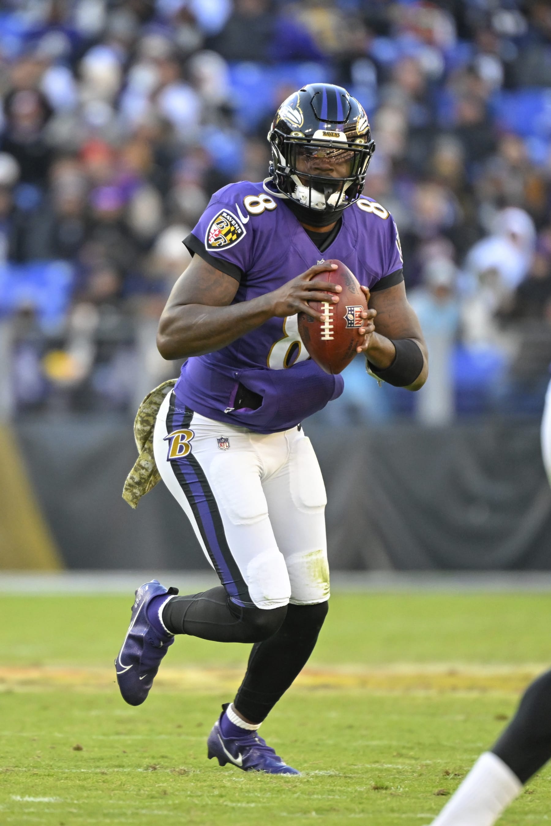 Baltimore Ravens quarterback Lamar Jackson (8) looks to pass the ball \during the second half of an NFL football game against the Carolina Panthers, Sunday, Nov. 20, 2022, in Baltimore. (AP Photo/Terrance Williams)