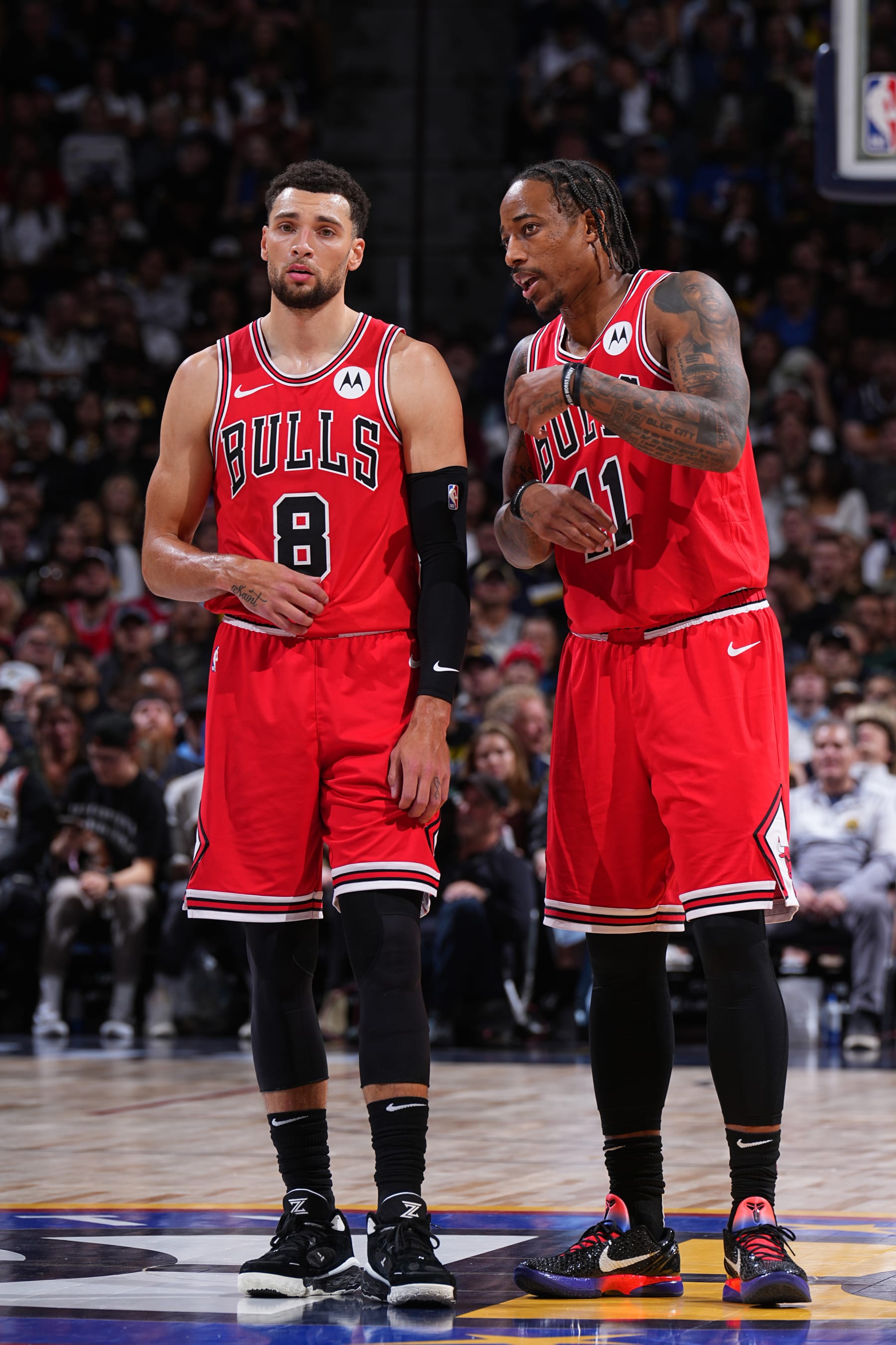 DENVER, CO - NOVEMBER 4: Zach LaVine #8 and DeMar DeRozan #11 of the Chicago Bulls talk during the game against the Denver Nuggets on November 4, 2023 at the Ball Arena in Denver, Colorado. NOTE TO USER: User expressly acknowledges and agrees that, by downloading and/or using this Photograph, user is consenting to the terms and conditions of the Getty Images License Agreement. Mandatory Copyright Notice: Copyright 2023 NBAE (Photo by Garrett Ellwood/NBAE via Getty Images)