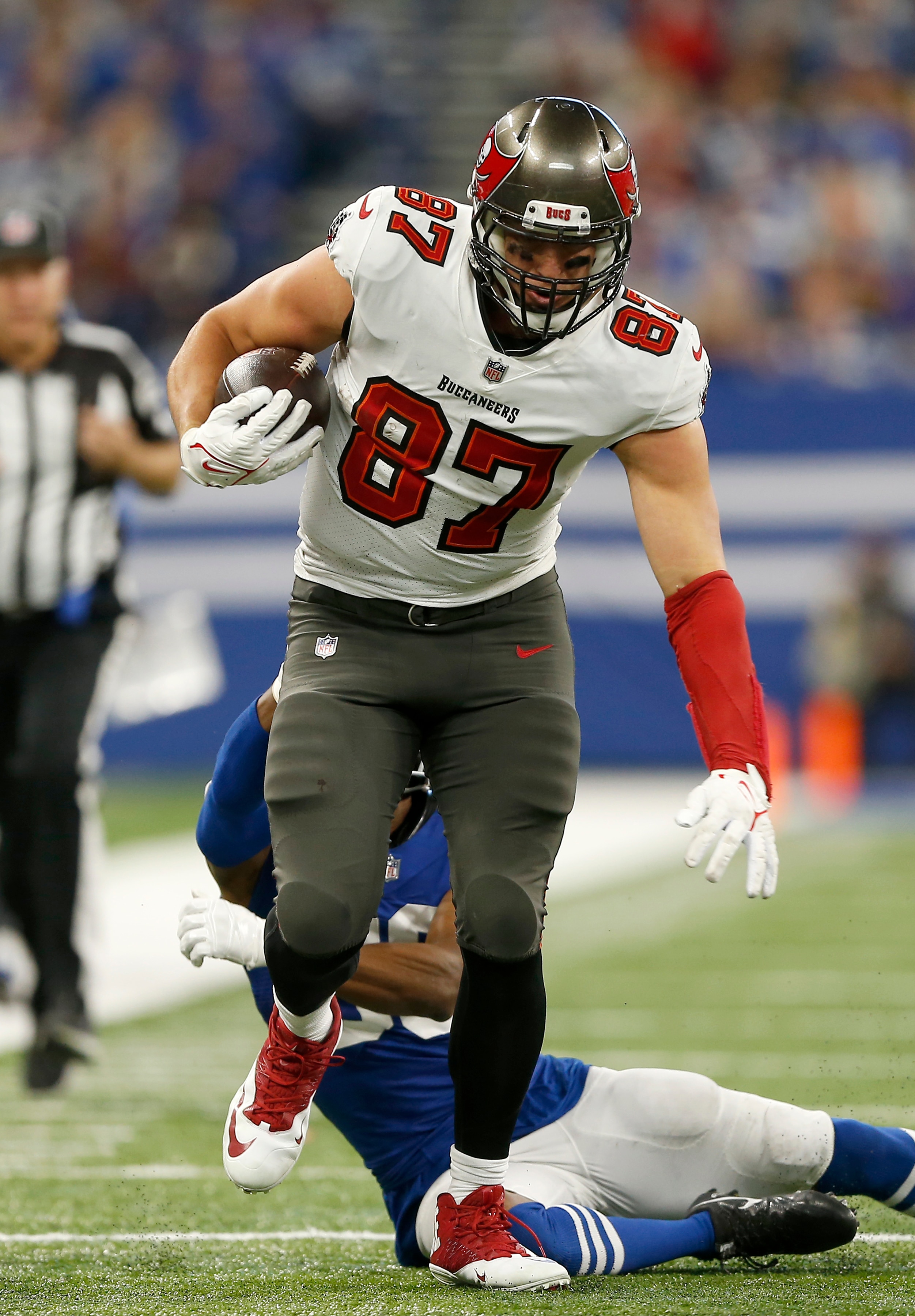 INDIANAPOLIS, IN - NOVEMBER 28: Tampa Bay Buccaneers Tight End Rob Gronkowski (87) breaks the tackle of Indianapolis Colts Safety George Odum (30) and heads up field during a NFL game between the Tampa Bay Buccaneers and the Indianapolis Colts on November 28, 2021, at Lucas Oil Stadium in Indianapolis, IN. (Photo by Jeffrey Brown/Icon Sportswire via Getty Images)