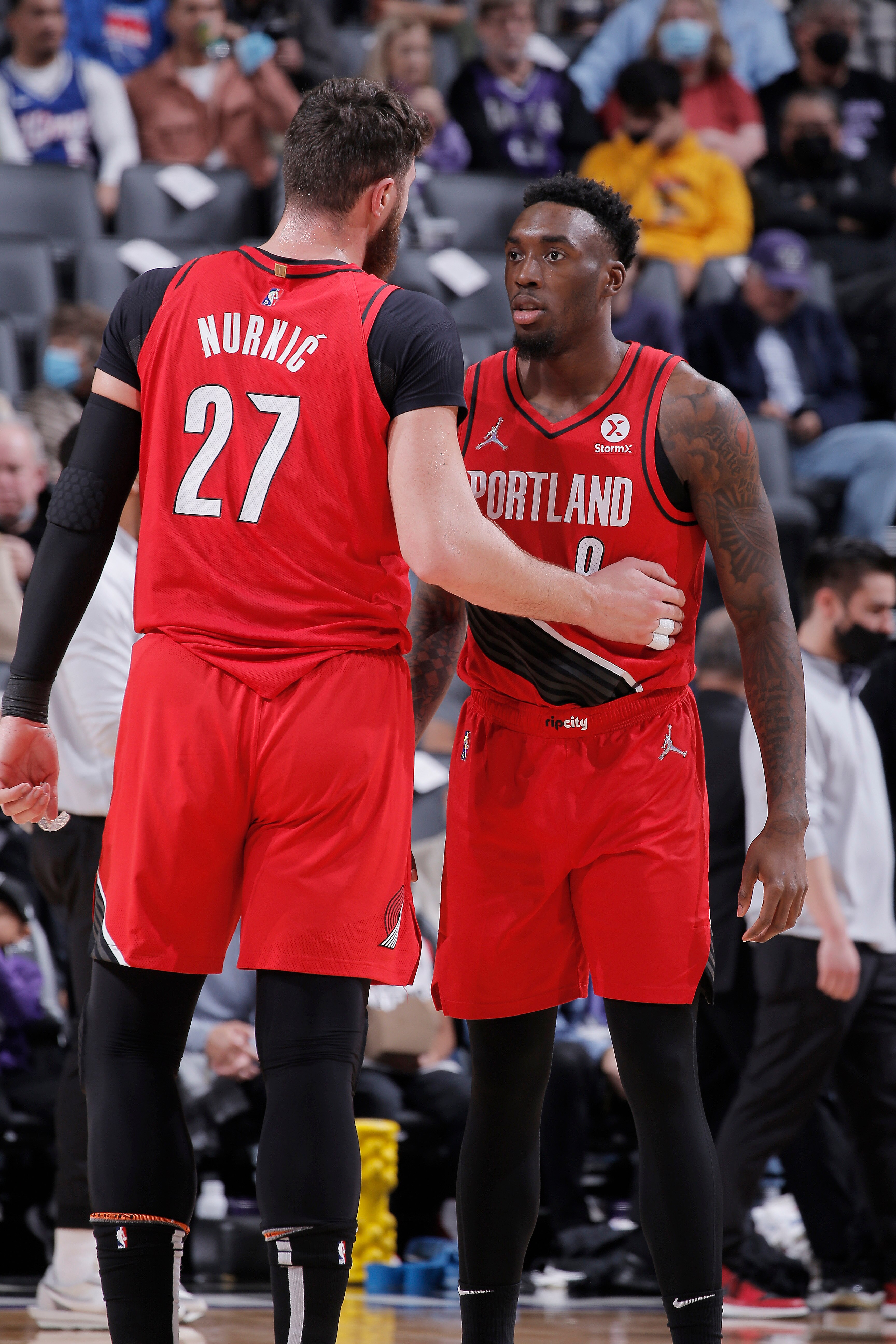 SACRAMENTO, CA - NOVEMBER 24: Jusuf Nurkic #27 and Nassir Little #9 of the Portland Trail Blazers talk during the game against the Sacramento Kings on November 24, 2021 at Golden 1 Center in Sacramento, California. NOTE TO USER: User expressly acknowledges and agrees that, by downloading and or using this photograph, User is consenting to the terms and conditions of the Getty Images Agreement. Mandatory Copyright Notice: Copyright 2021 NBAE (Photo by Rocky Widner/NBAE via Getty Images)