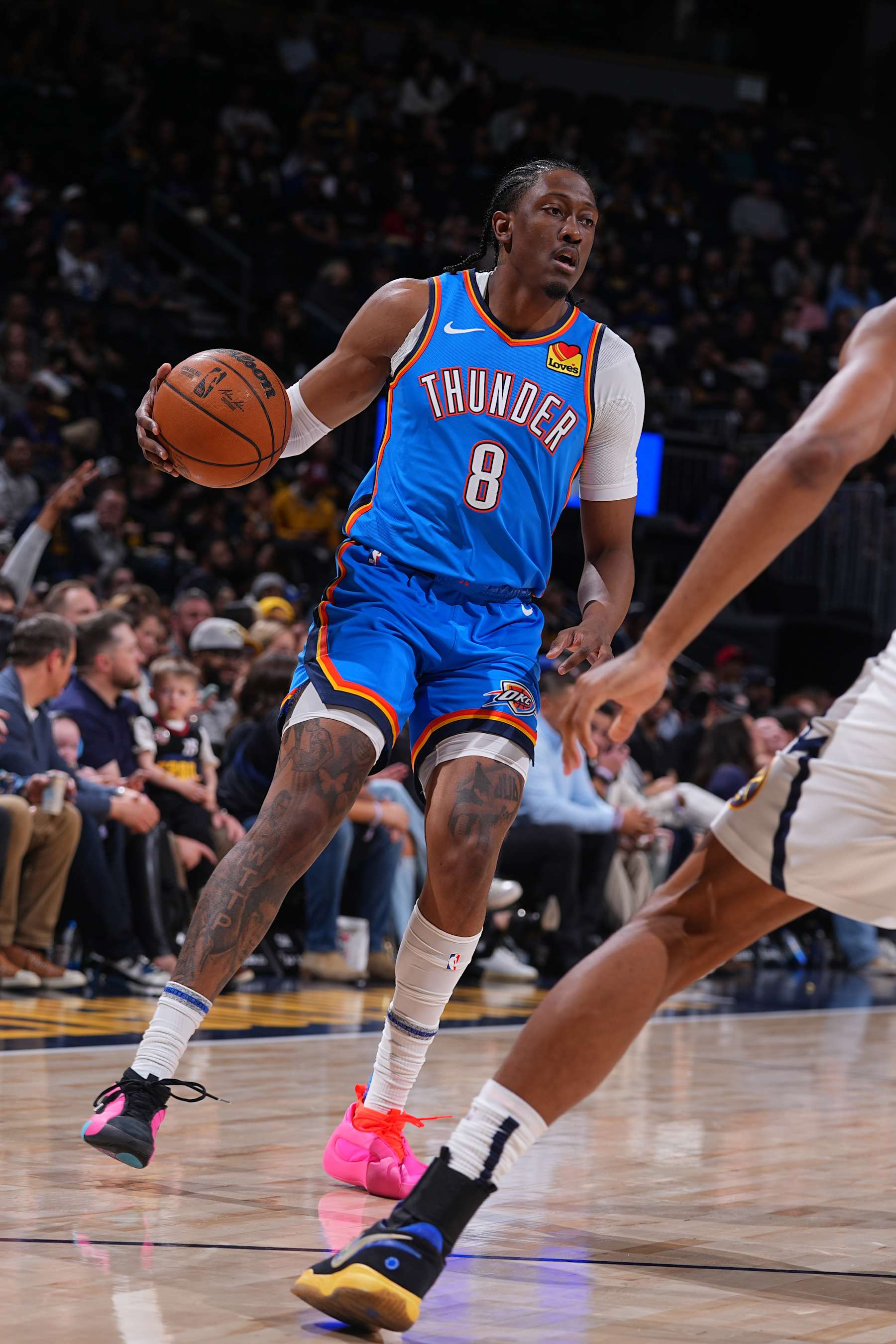 DENVER, CO - OCTOBER 15:  Jalen Williams #8 of the Oklahoma City Thunder dribbles the ball during the game against the Denver Nuggets during a NBA pre season game on October 15, 2024 at Ball Arena in Denver, Colorado. NOTE TO USER: User expressly acknowledges and agrees that, by downloading and/or using this Photograph, user is consenting to the terms and conditions of the Getty Images License Agreement. Mandatory Copyright Notice: Copyright 2024 NBAE (Photo by Bart Young/NBAE via Getty Images)