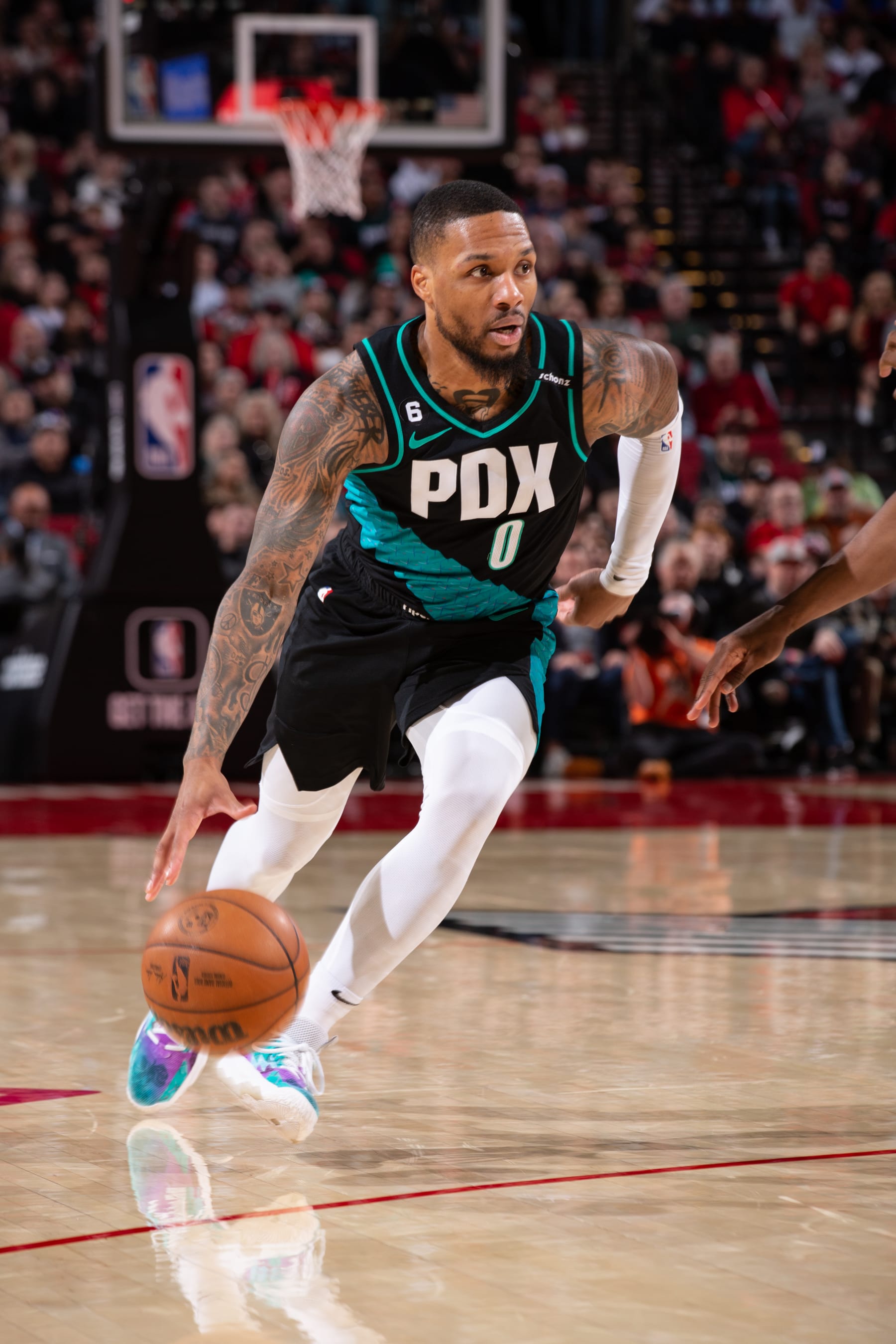 PORTLAND, OR - MARCH 1:  Damian Lillard #0 of the Portland Trail Blazers goes to the basket during the game on March 1, 2023 at the Moda Center Arena in Portland, Oregon. NOTE TO USER: User expressly acknowledges and agrees that, by downloading and or using this photograph, user is consenting to the terms and conditions of the Getty Images License Agreement. Mandatory Copyright Notice: Copyright 2023 NBAE (Photo by Cameron Browne/NBAE via Getty Images)