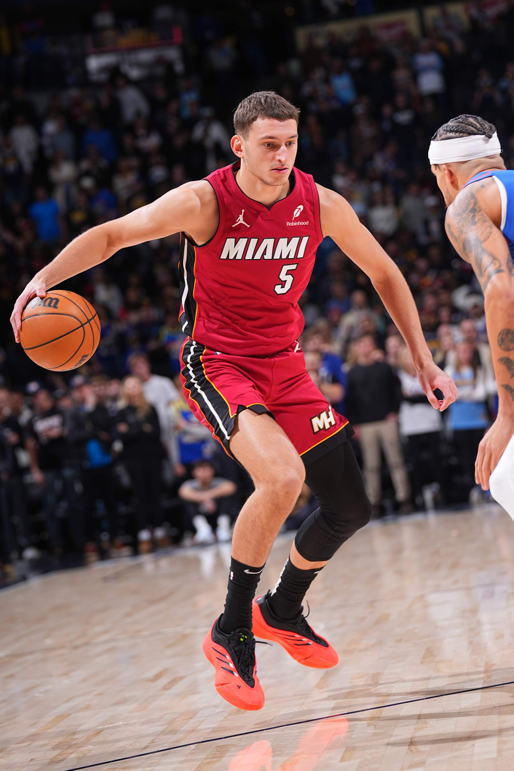 DENVER, CO - NOVEMBER 8: Nikola Jovic #5 of the Miami Heat dribbles the ball during the game against the Denver Nuggets on November 8, 2024 at Ball Arena in Denver, Colorado. NOTE TO USER: User expressly acknowledges and agrees that, by downloading and/or using this Photograph, user is consenting to the terms and conditions of the Getty Images License Agreement. Mandatory Copyright Notice: Copyright 2024 NBAE (Photo by Bart Young/NBAE via Getty Images)