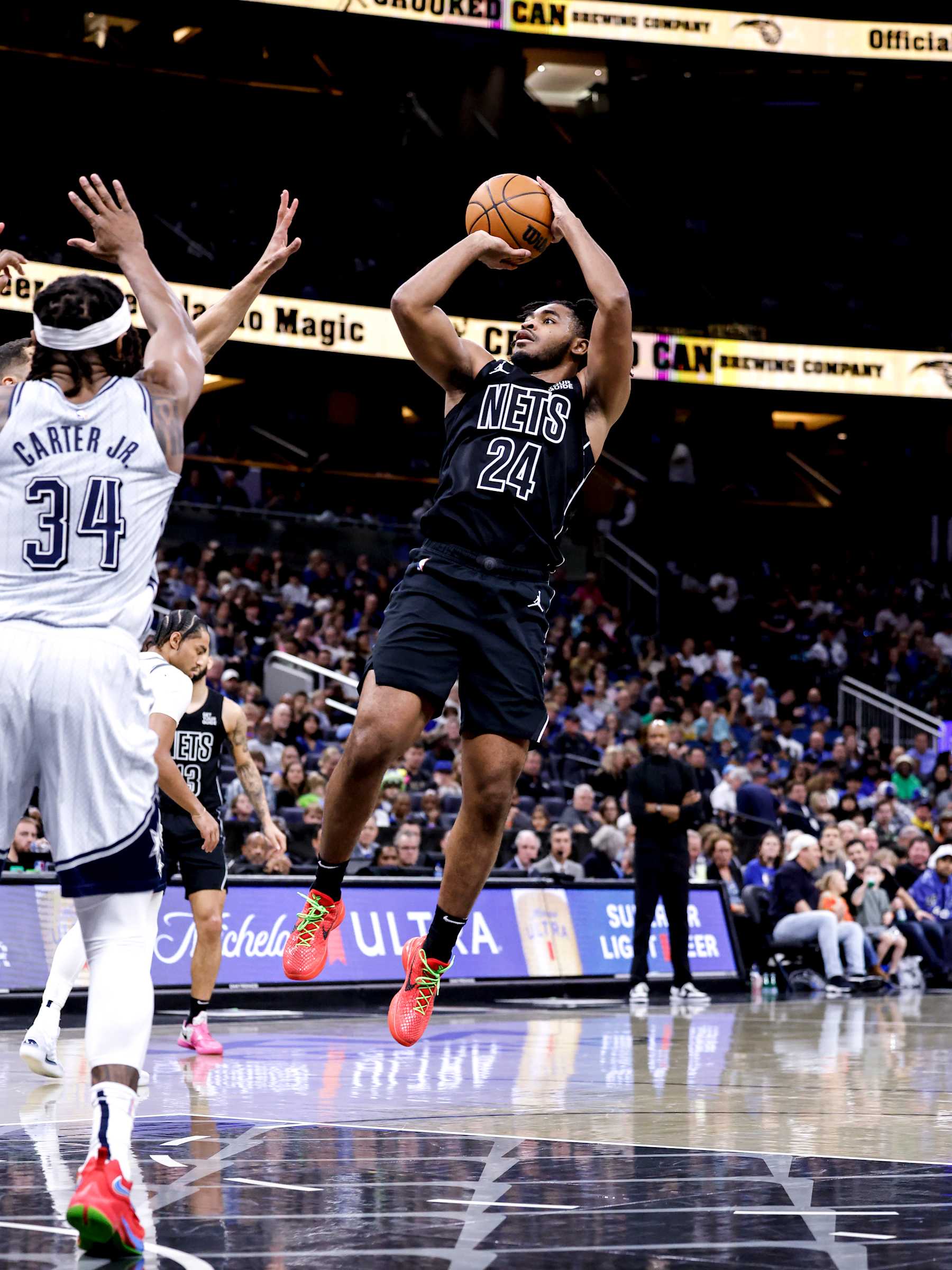ORLANDO, FL - DECEMBER 29: Cam Thomas #24 of the Brooklyn Nets pulls up for a jumpshot over Wendell Carter Jr. #34 of the Orlando Magic during the first half at the Kia Center on December 29, 2024 in Orlando, Florida. The Magic defeated the Nets 102-101. NOTE TO USER: User expressly acknowledges and agrees that, by downloading and or using this photograph, User is consenting to the terms and conditions of the Getty Images License Agreement. (Photo by Don Juan Moore/Getty Images)