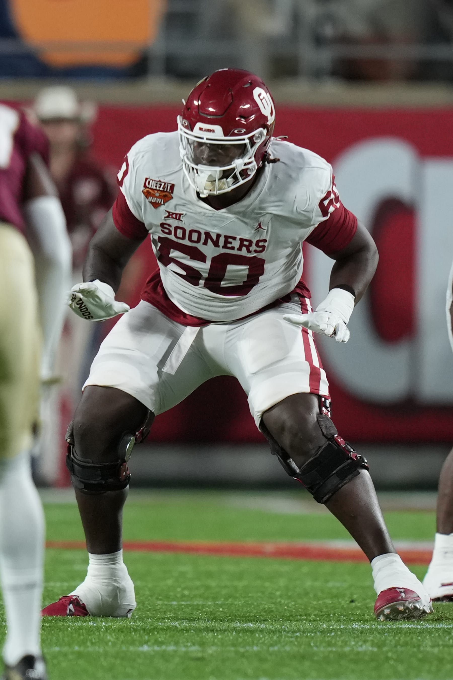 ORLANDO, FL - DECEMBER 29: Oklahoma Sooners offensive lineman Tyler Guyton (60) protects the pocket during the Cheez-It Bowl between between the Oklahoma Sooners and the Florida State Seminoles on Thursday, December 29, 2022 at Camping World Stadium, Orlando, Fla. (Photo by Peter Joneleit/Icon Sportswire via Getty Images)