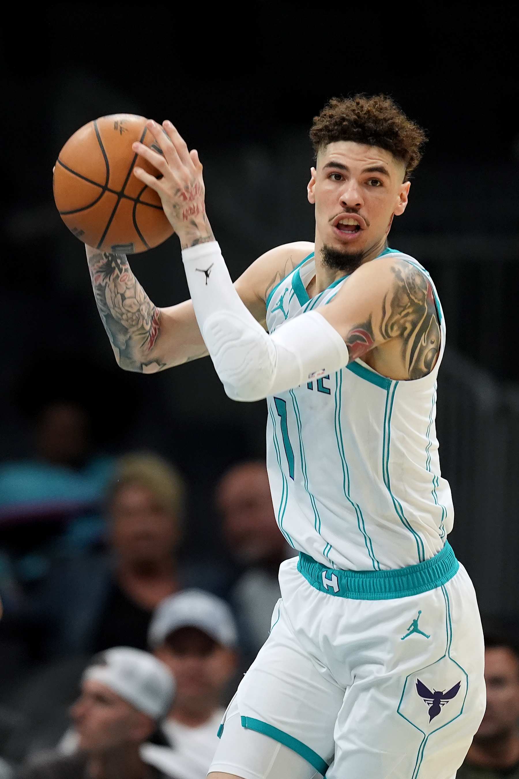 CHARLOTTE, NORTH CAROLINA - OCTOBER 08: LaMelo Ball #1 of the Charlotte Hornets rebounds Miami Heat during the preseason game at Spectrum Center on October 08, 2024 in Charlotte, North Carolina. NOTE TO USER: User expressly acknowledges and agrees that, by downloading and or using this photograph, User is consenting to the terms and conditions of the Getty Images License Agreement. (Photo by Grant Halverson/Getty Images)