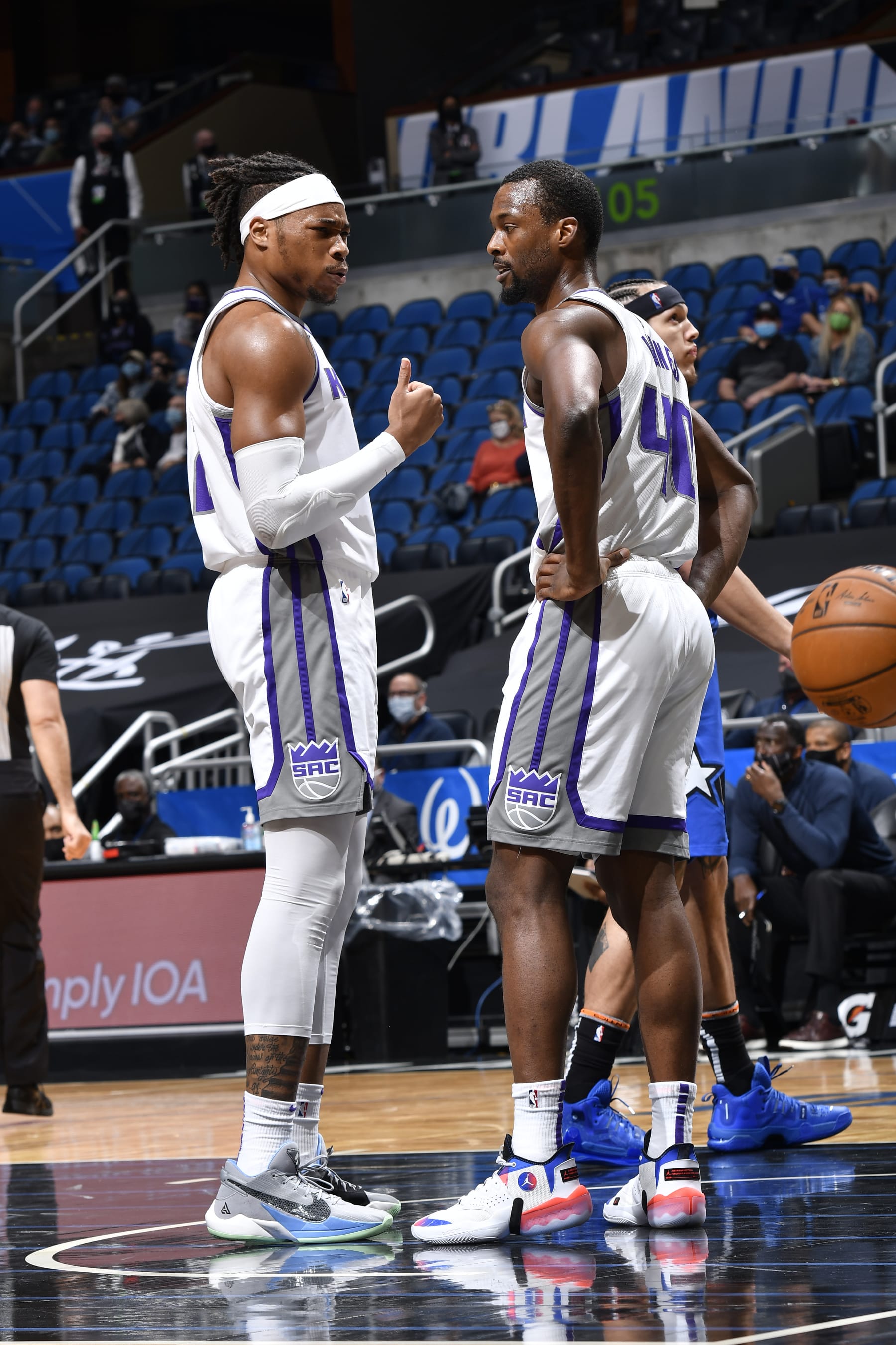 ORLANDO, FL - JANUARY 27: Richaun Holmes #22 talks with Harrison Barnes #40 of the Sacramento Kings during the game against the Orlando Magic on January 27, 2021 at Amway Center in Orlando, Florida. NOTE TO USER: User expressly acknowledges and agrees that, by downloading and or using this photograph, User is consenting to the terms and conditions of the Getty Images License Agreement. Mandatory Copyright Notice: Copyright 2021 NBAE (Photo by Fernando Medina/NBAE via Getty Images)