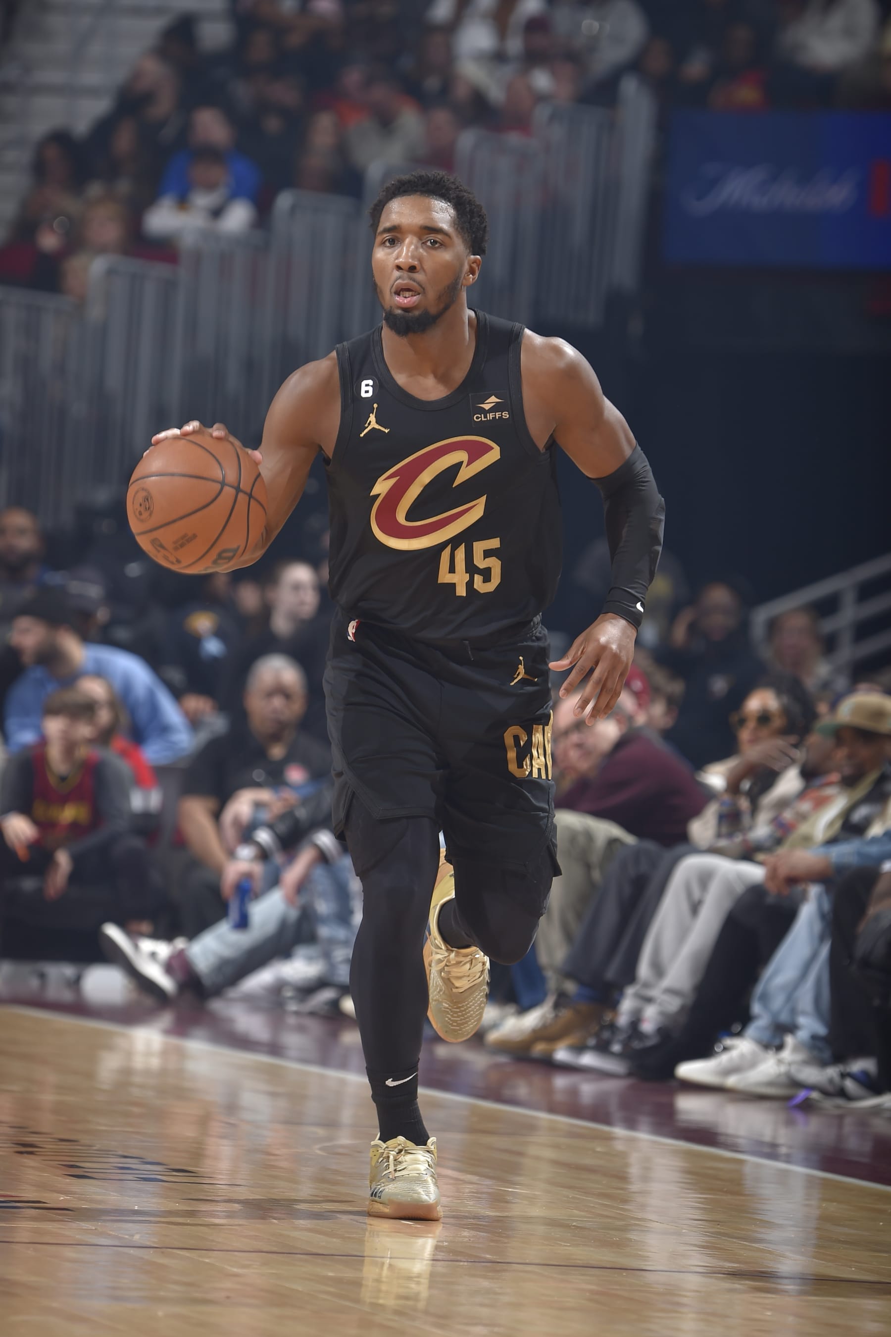 CLEVELAND, OH - DECEMBER 17: Donovan Mitchell #45 of the Cleveland Cavaliers dribbles the ball during the game against the Dallas Mavericks on December 17, 2022 at Rocket Mortgage FieldHouse in Cleveland, Ohio. NOTE TO USER: User expressly acknowledges and agrees that, by downloading and/or using this Photograph, user is consenting to the terms and conditions of the Getty Images License Agreement. Mandatory Copyright Notice: Copyright 2022 NBAE (Photo by David Liam Kyle/NBAE via Getty Images)