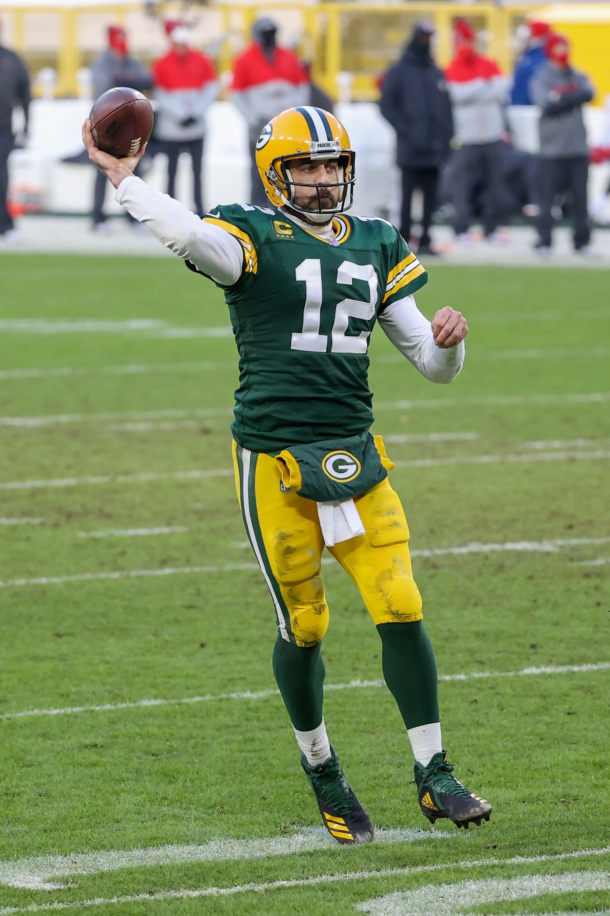 GREEN BAY, WISCONSIN - JANUARY 24: Aaron Rodgers #12 of the Green Bay Packers throws a pass in the third quarter against the Tampa Bay Buccaneers during the NFC Championship game at Lambeau Field on January 24, 2021 in Green Bay, Wisconsin. (Photo by Dylan Buell/Getty Images)