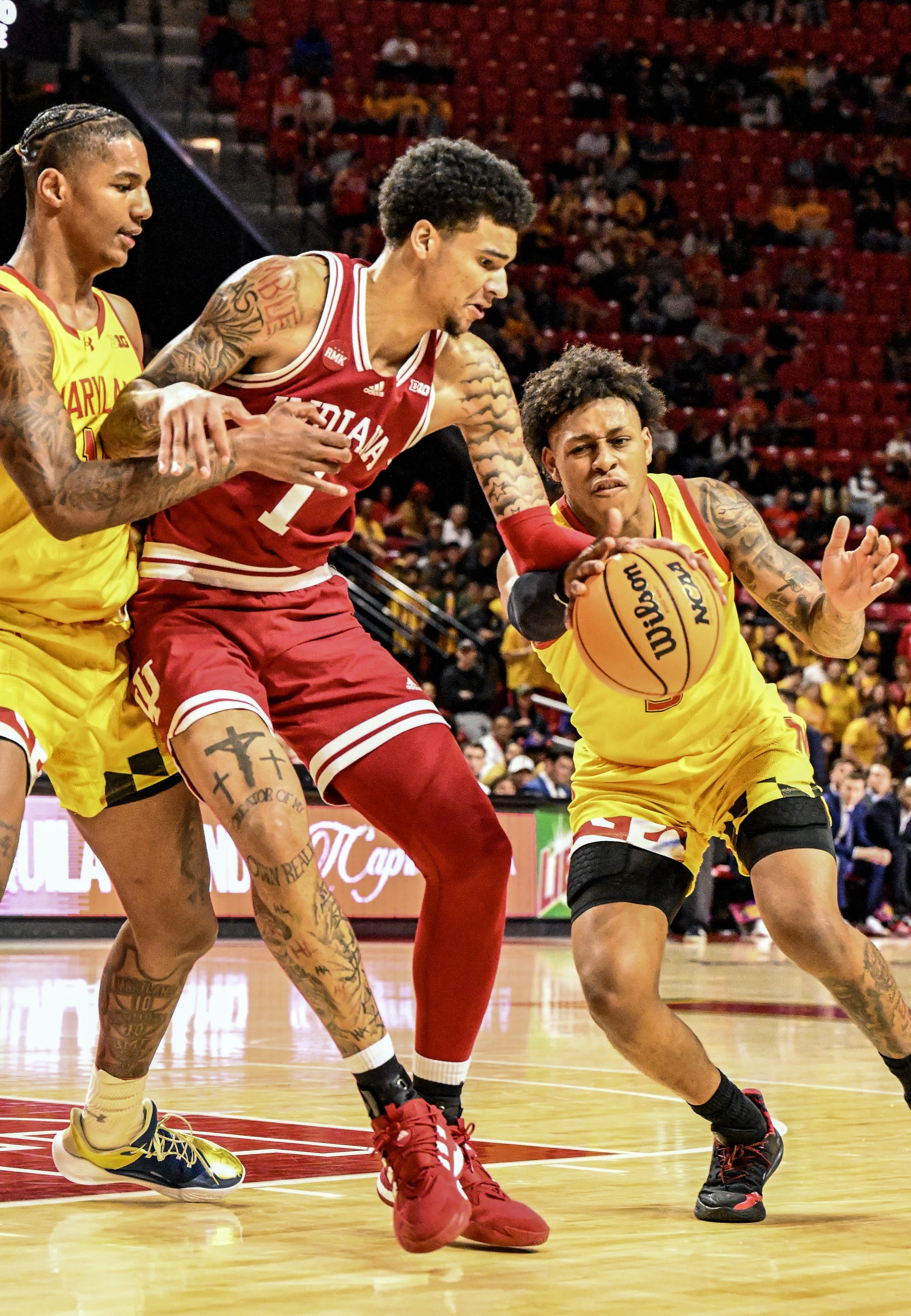 COLLEGE PARK, MD - MARCH 03: Maryland Terrapins guard DeShawn Harris-Smith (5) steals the ball from Indiana Hoosiers center Kel'el Ware (1) as forward Julian Reese (10) plays defense during the Indiana Hoosiers  game versus the Maryland Terrapins on March 3, 2024 at Xfinity Center in College Park, MD. (Photo by Mark Goldman/Icon Sportswire via Getty Images)
