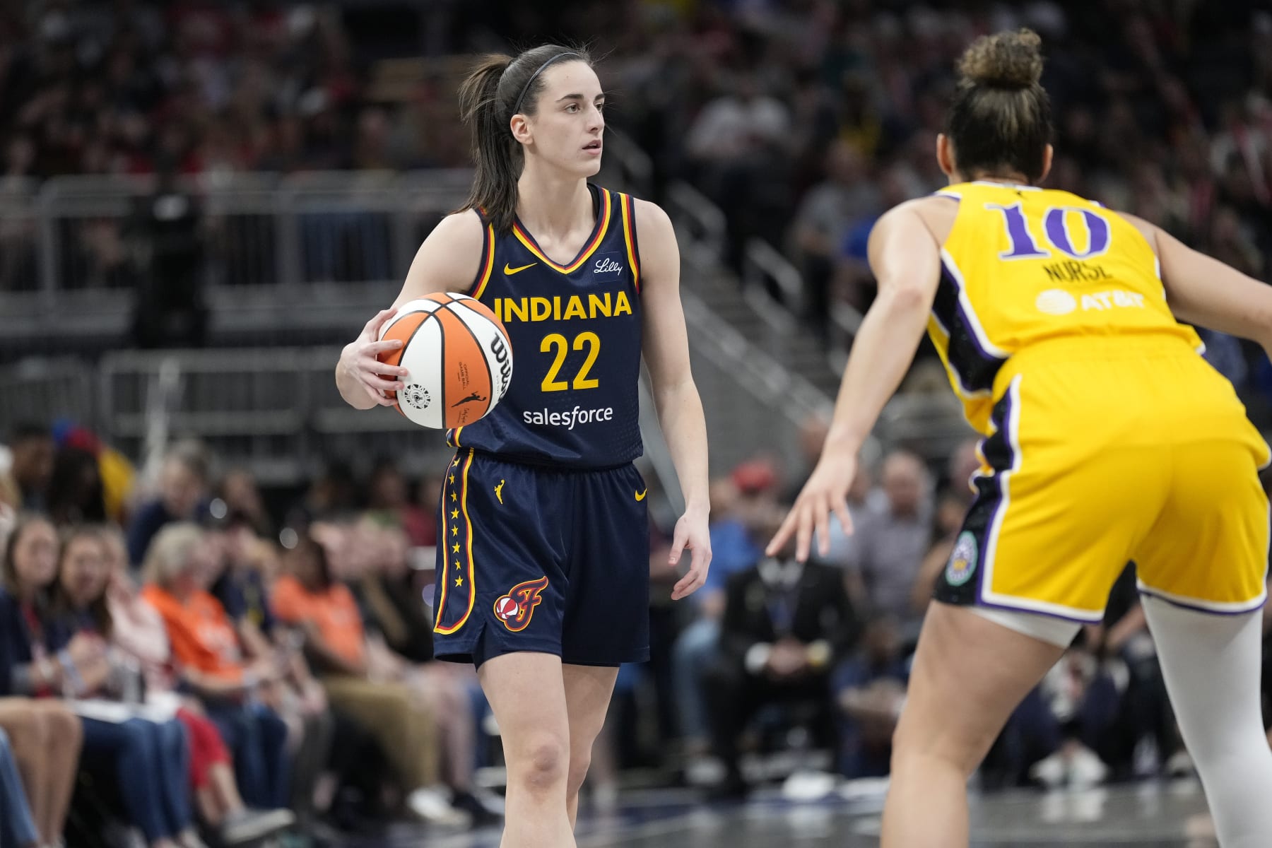 INDIANAPOLIS, IN - MAY 28: Caitlin Clark #22 of the Indiana Fever dribbles the ball during the game against the Los Angeles Sparks on May 28, 2024 at Gainbridge Fieldhouse in Indianapolis, Indiana. NOTE TO USER: User expressly acknowledges and agrees that, by downloading and or using this Photograph, user is consenting to the terms and conditions of the Getty Images License Agreement. Mandatory Copyright Notice: Copyright 2024 NBAE (Photo by A.J. Mast/NBAE via Getty Images)